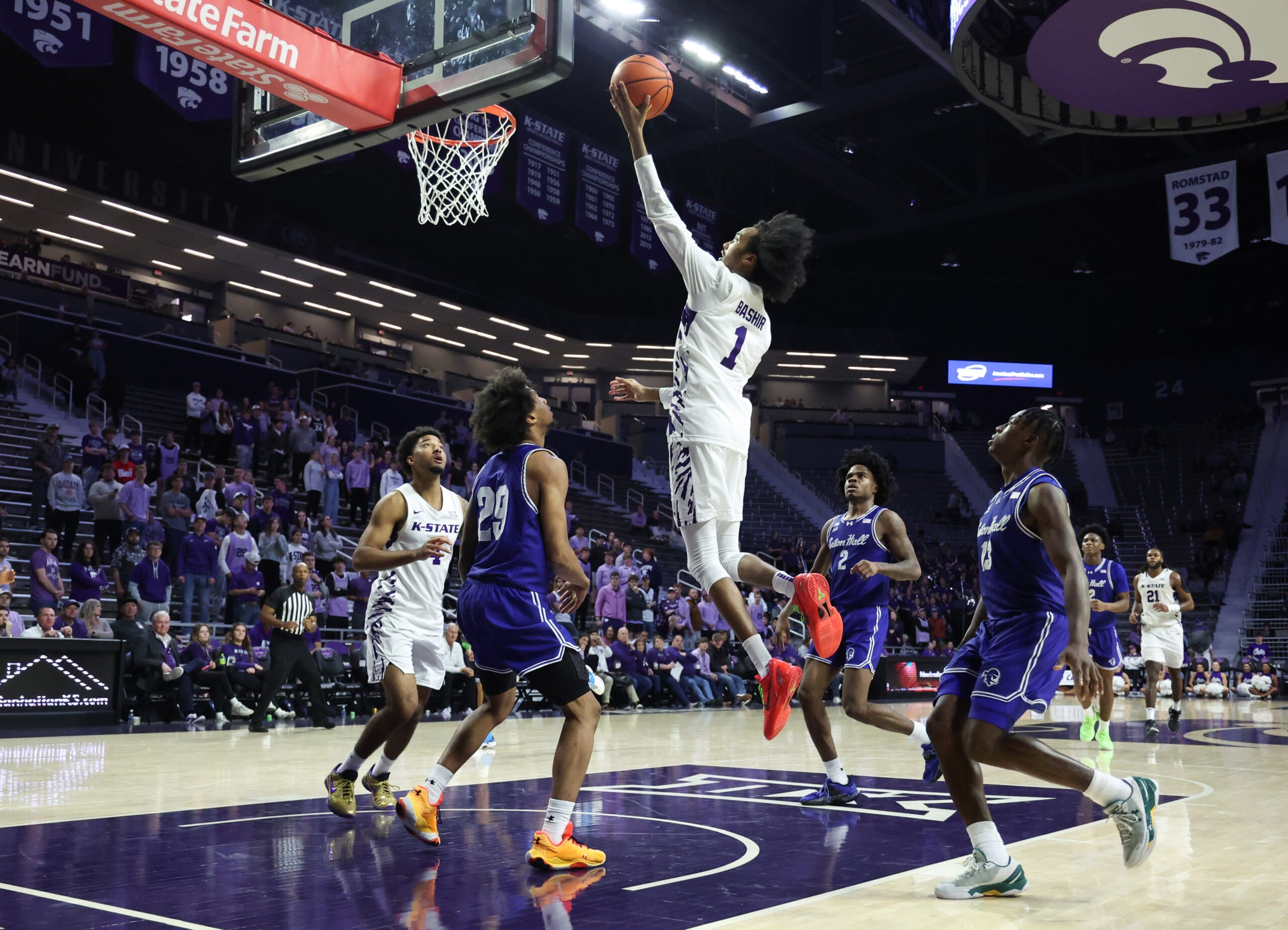 Dec 6, 2025; Manhattan, Kansas, USA; Kansas State Wildcats guard Abdi Bashir Jr. (1) goes to the basket against Seton Hall Pirates guard Mike Williams (29) during the second half at Bramlage Coliseum. Mandatory Credit: Scott Sewell-Imagn Images