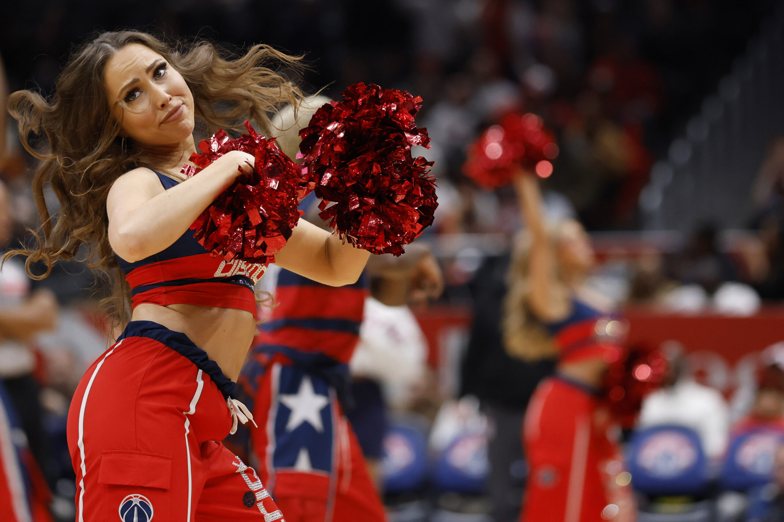 Dec 6, 2025; Washington, District of Columbia, USA; A member of the Washington Wizards Dancers dances during a timeout against the Atlanta Hawks in the second half at Capital One Arena. Mandatory Credit: Geoff Burke-Imagn Images