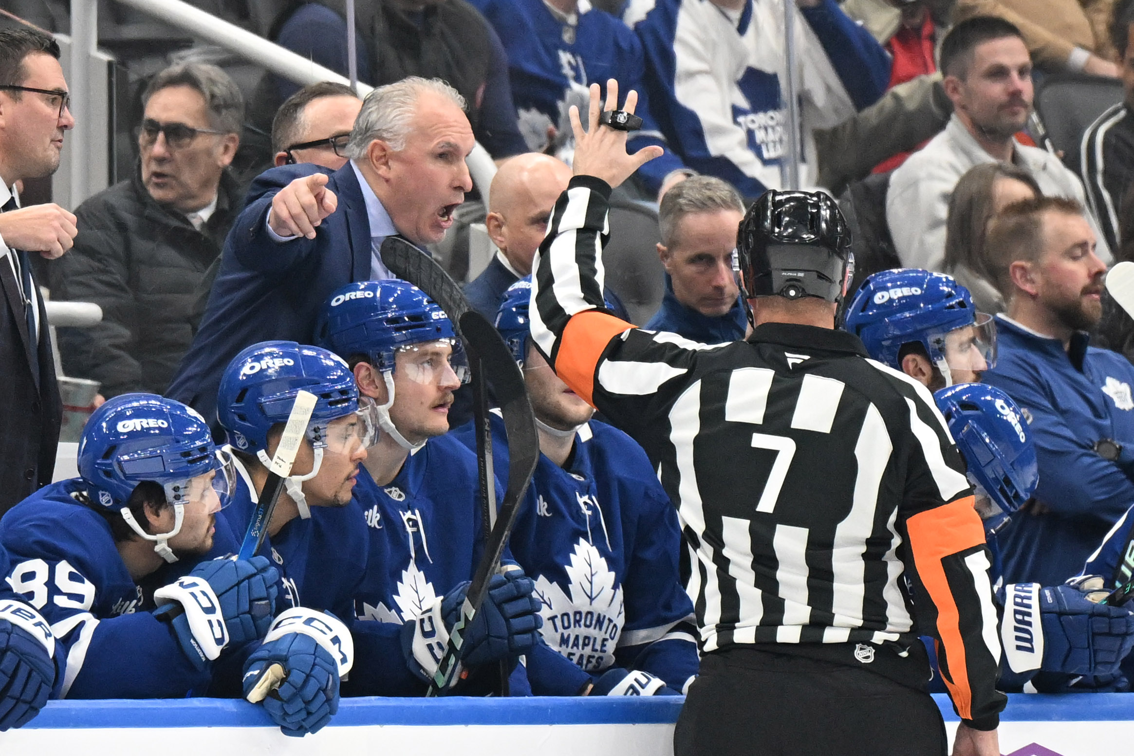 Dec 6, 2025; Toronto, Ontario, CAN;  Toronto Maple Leafs head coach Craig Berube gestures as he speaks to referee Garrett Rank (7) in the first period at Scotiabank Arena. Mandatory Credit: Dan Hamilton-Imagn Images