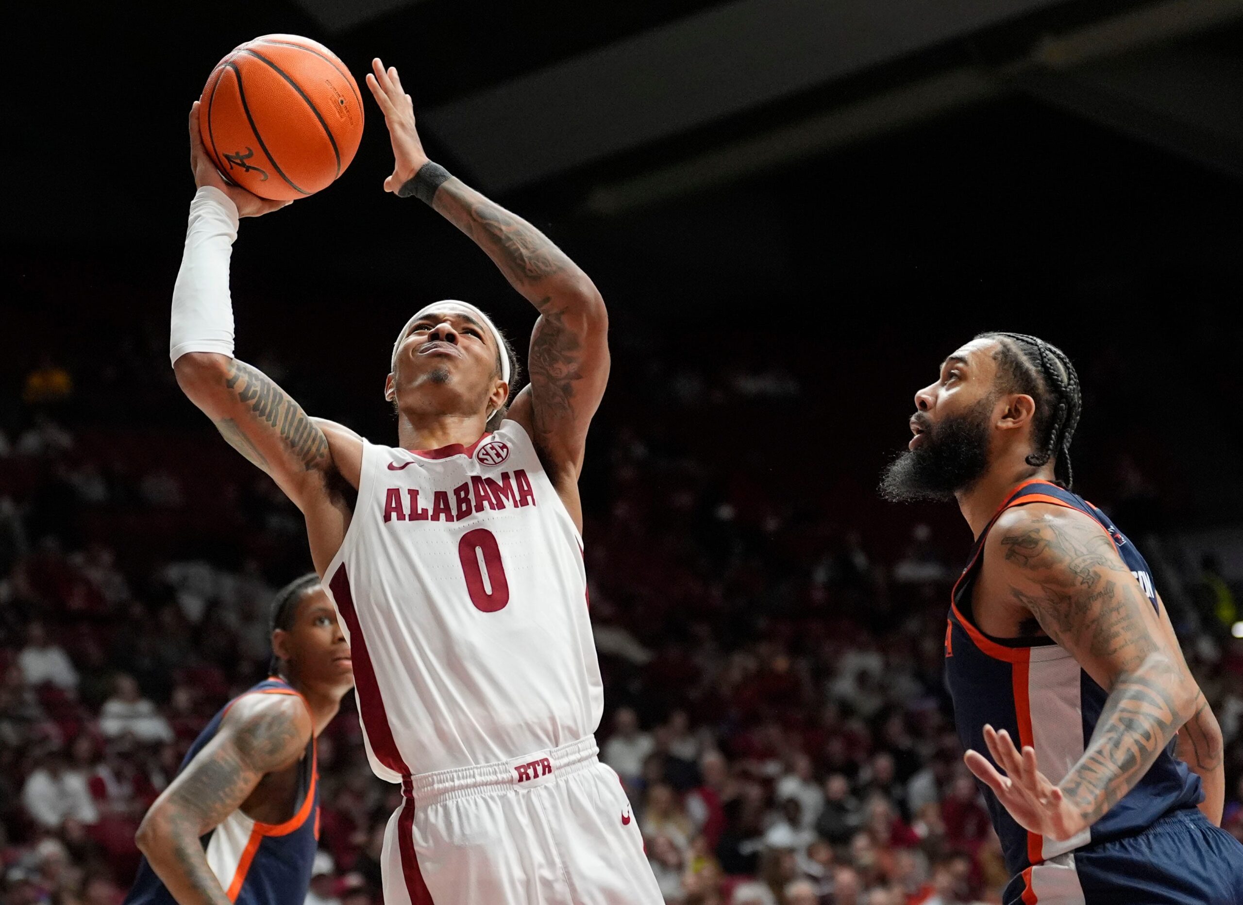 Dec 7, 2025; Tuscaloosa, AL, USA; Alabama guard Labaron Philon Jr. (0) goes to the basket against UTSA guard Jamir Simpson (7) at Coleman Coliseum. Mandatory Credit: Gary Cosby Jr.-Tuscaloosa News