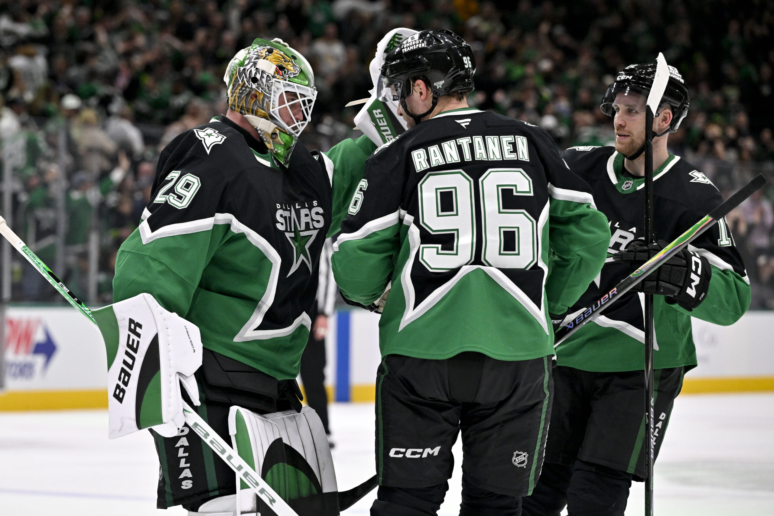 Dec 7, 2025; Dallas, Texas, USA; Dallas Stars goaltender Jake Oettinger (29) and right wing Mikko Rantanen (96) and center Radek Faksa (12) celebrate after the Stars defeat the Pittsburgh Penguins at American Airlines Center. Mandatory Credit: Jerome Miron-Imagn Images