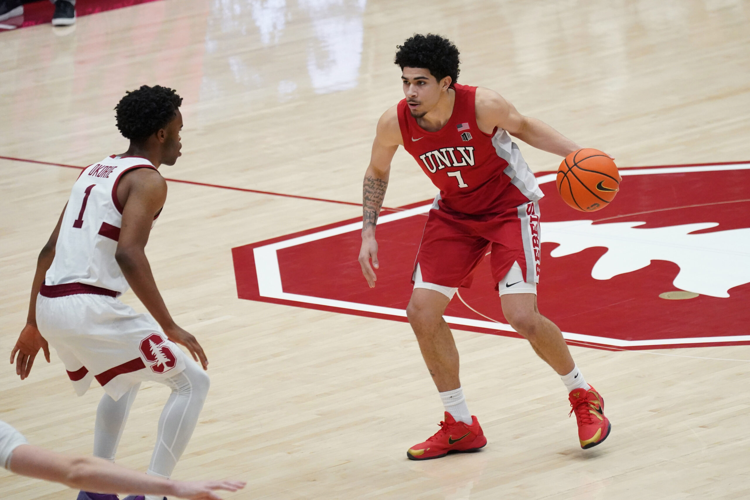 Dec 7, 2025; Stanford, California, USA;  UNLV Runnin' Rebels guard Al Green (7) dribbles upcourt against Stanford Cardinal guard Ebuka Okorie (1) in the second half at Maples Pavilion. Mandatory Credit: David Gonzales-Imagn Images