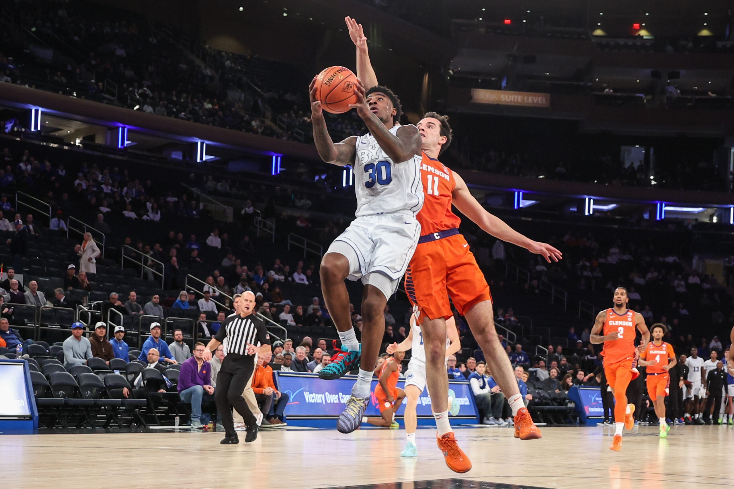 Dec 9, 2025; New York, New York, USA;  BYU Cougars guard Kennard Davis Jr. (30) and Clemson Tigers forward Nick Davidson (11) at Madison Square Garden. Mandatory Credit: Wendell Cruz-Imagn Images