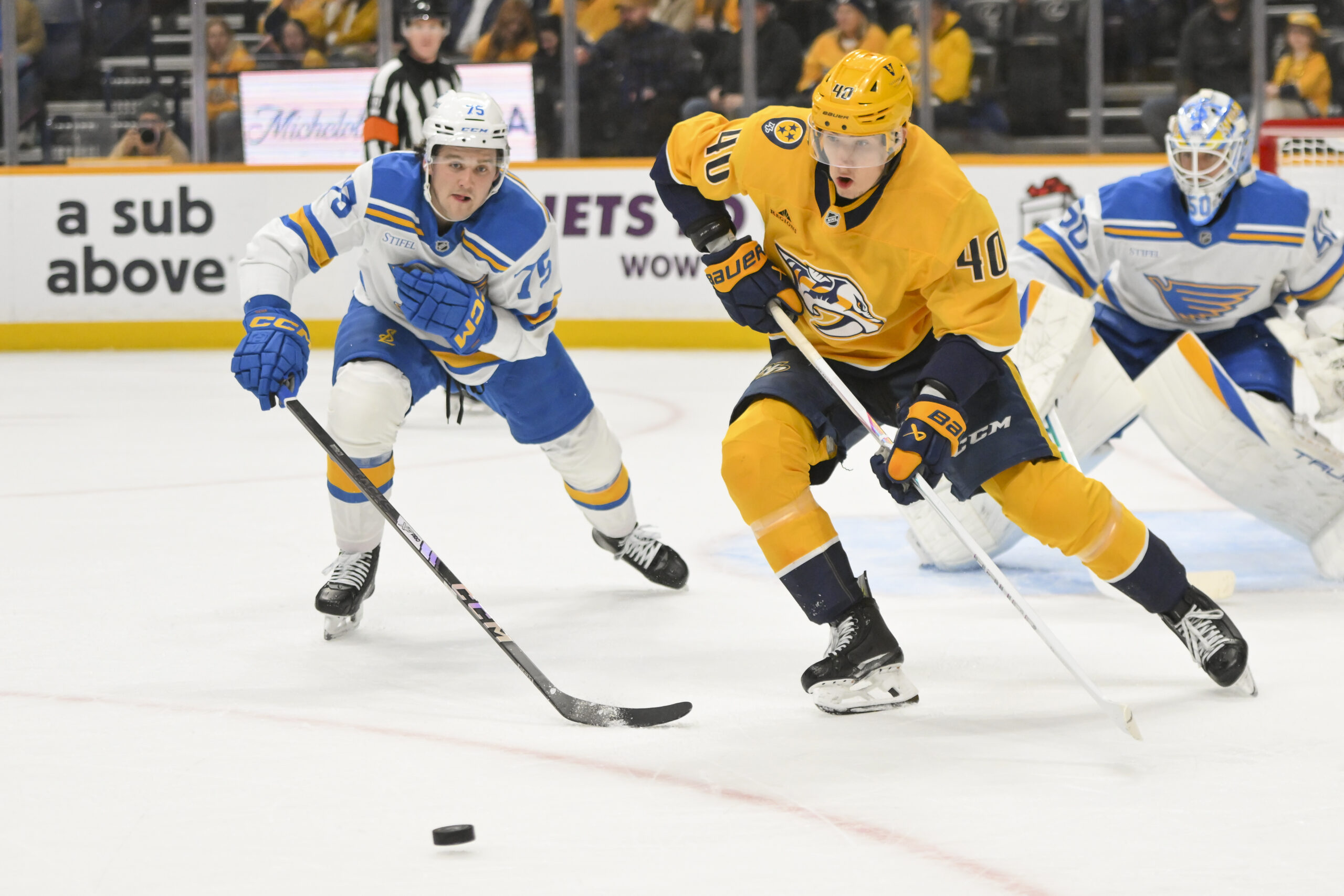 Dec 11, 2025; Nashville, Tennessee, USA;  Nashville Predators center Fedor Svechkiv (40) skates with the puck against the St. Louis Blues during the first period at Bridgestone Arena. Mandatory Credit: Steve Roberts-Imagn Images