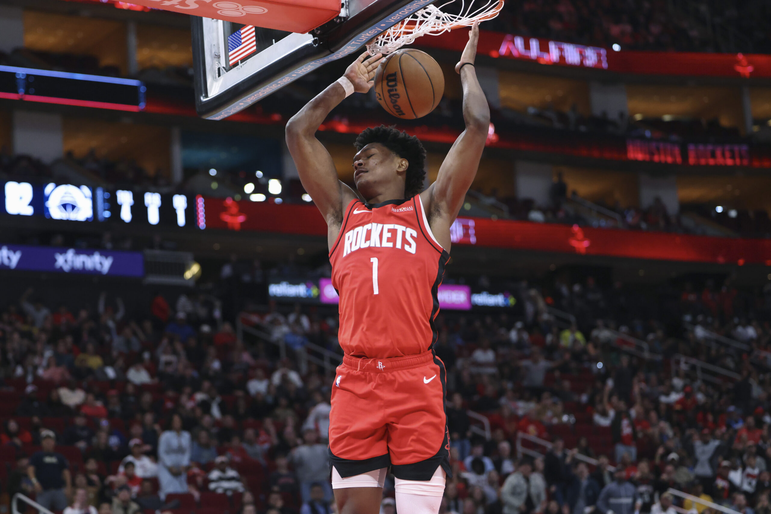 Dec 11, 2025; Houston, Texas, USA; Houston Rockets guard Amen Thompson (1) dunks the ball during the fourth quarter against the Los Angeles Clippers at Toyota Center. Mandatory Credit: Troy Taormina-Imagn Images