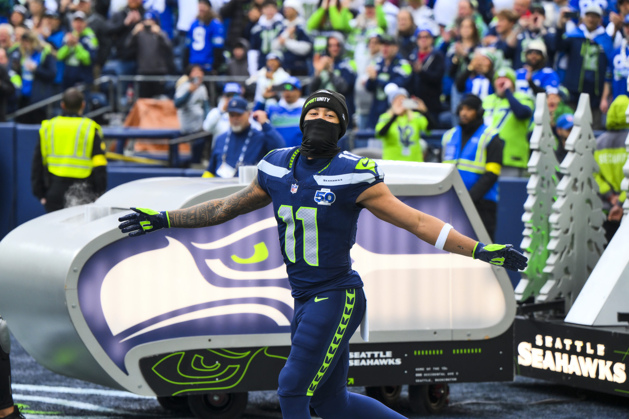 Dec 14, 2025; Seattle, Washington, USA; Seattle Seahawks wide receiver Jaxon Smith-Njigba (11) exits the tunnel during player introductions before a game against the Los Angeles Chargers at Lumen Field. Mandatory Credit: Steven Bisig-Imagn Images