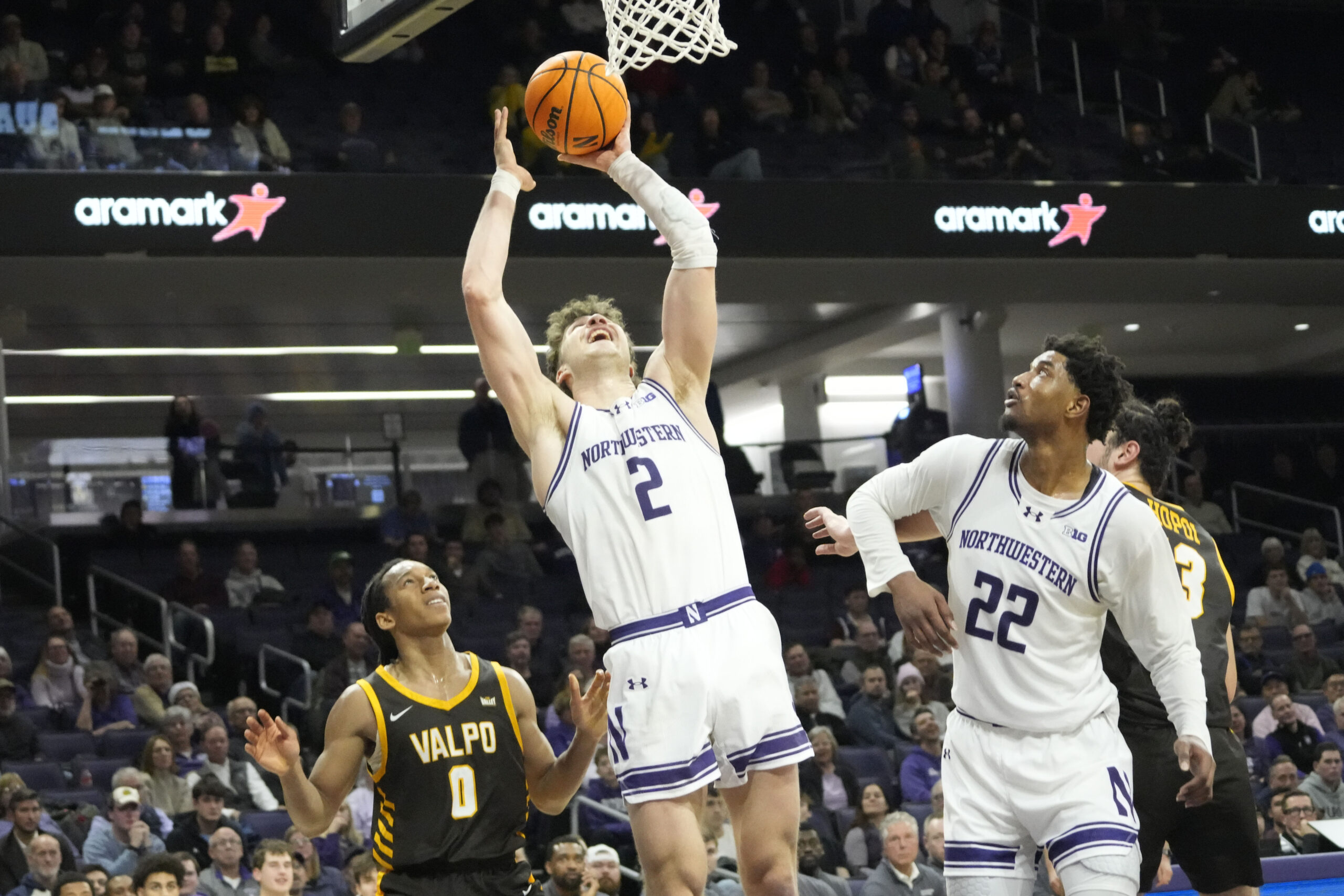 Dec 16, 2025; Evanston, Illinois, USA; Valparaiso Beacons guard Rakim Chaney (0) defends Northwestern Wildcats forward Nick Martinelli (2) during the second half at Welsh-Ryan Arena. Mandatory Credit: David Banks-Imagn Images