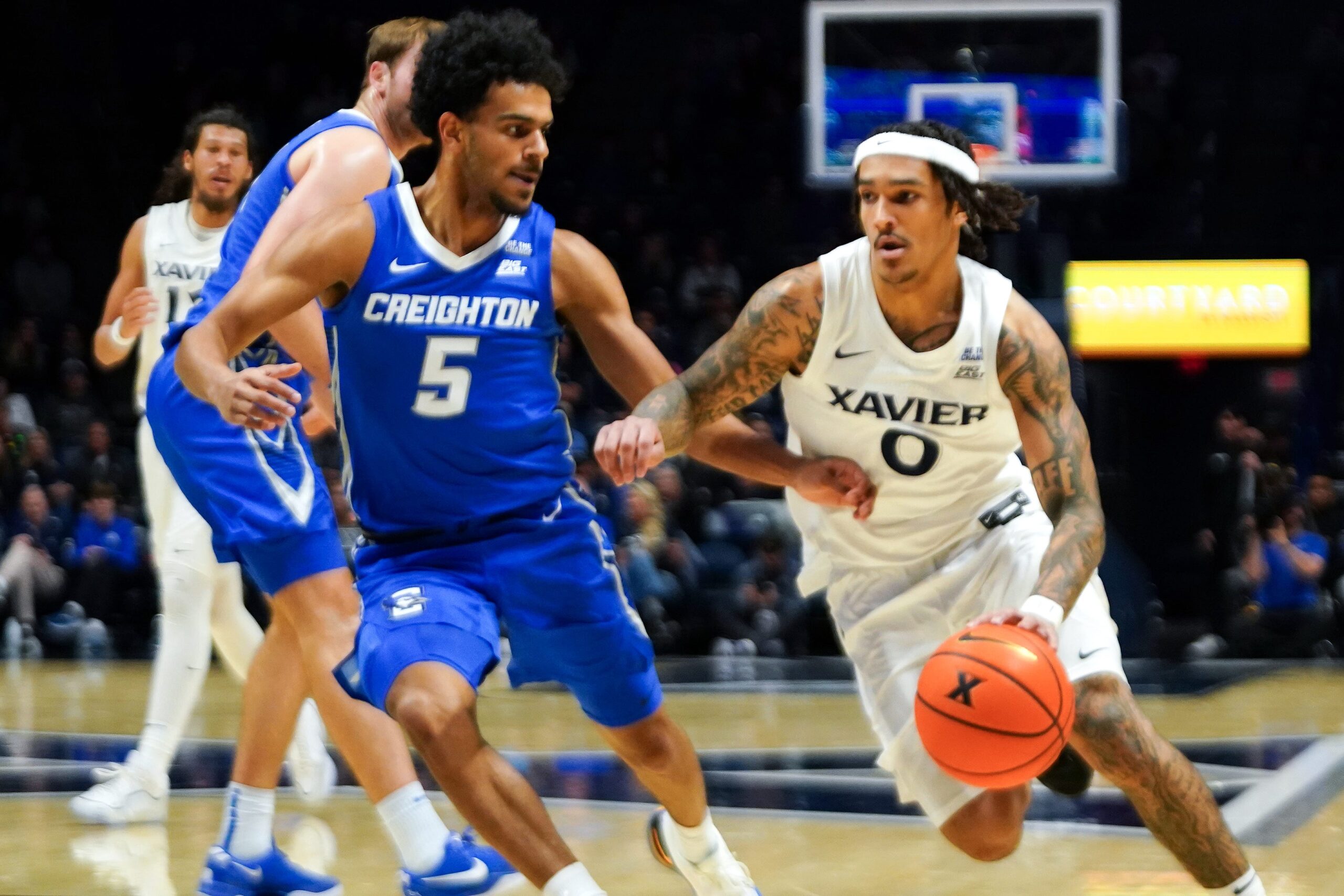 Xavier Musketeers guard Roddie Anderson III (0) drives the ball in the first half of a NCAA men’s basketball game between the Xavier Musketeers and Creighton Bluejays, Wednesday, Dec. 17, 2025, at Cintas Center in Cincinnati.