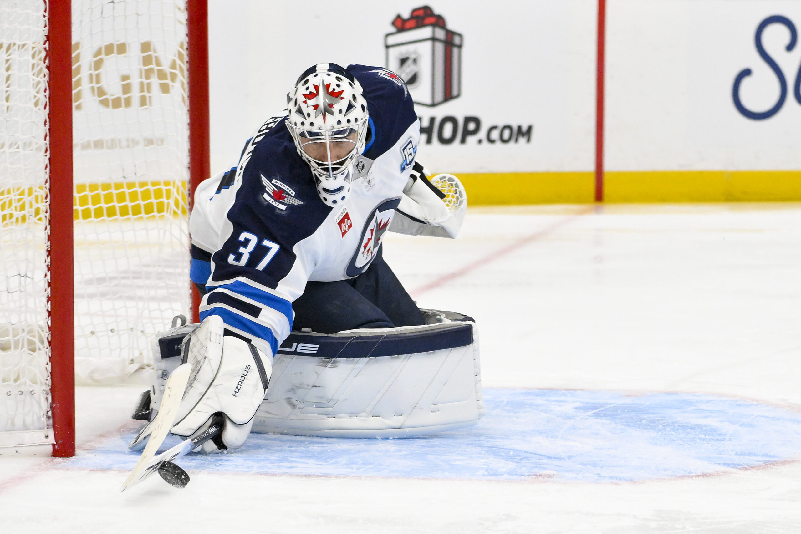 Dec 17, 2025; St. Louis, Missouri, USA; Winnipeg Jets goaltender Connor Hellebuyck (37) defends the net against the St. Louis Blues during the second period at Enterprise Center. Mandatory Credit: Jeff Curry-Imagn Images
