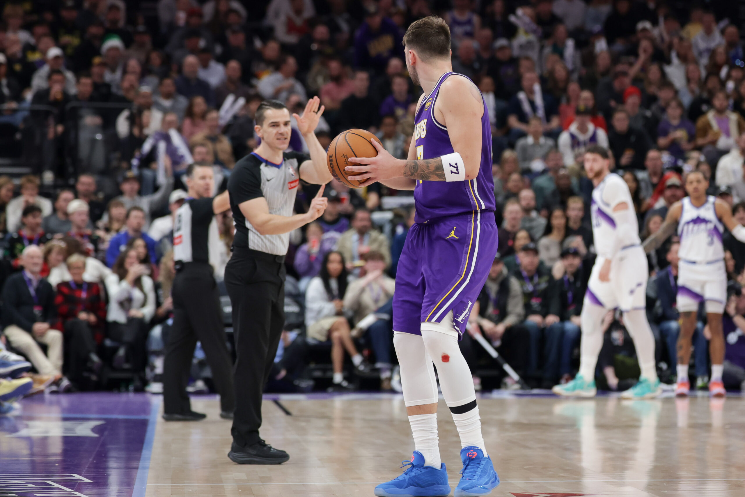 Dec 18, 2025; Salt Lake City, Utah, USA;  Los Angeles Lakers forward/guard Luka Doncic (77) is called for a technical foul after spiking the ball during the second half against the Utah Jazz at Delta Center. Mandatory Credit: Chris Nicoll-Imagn Images