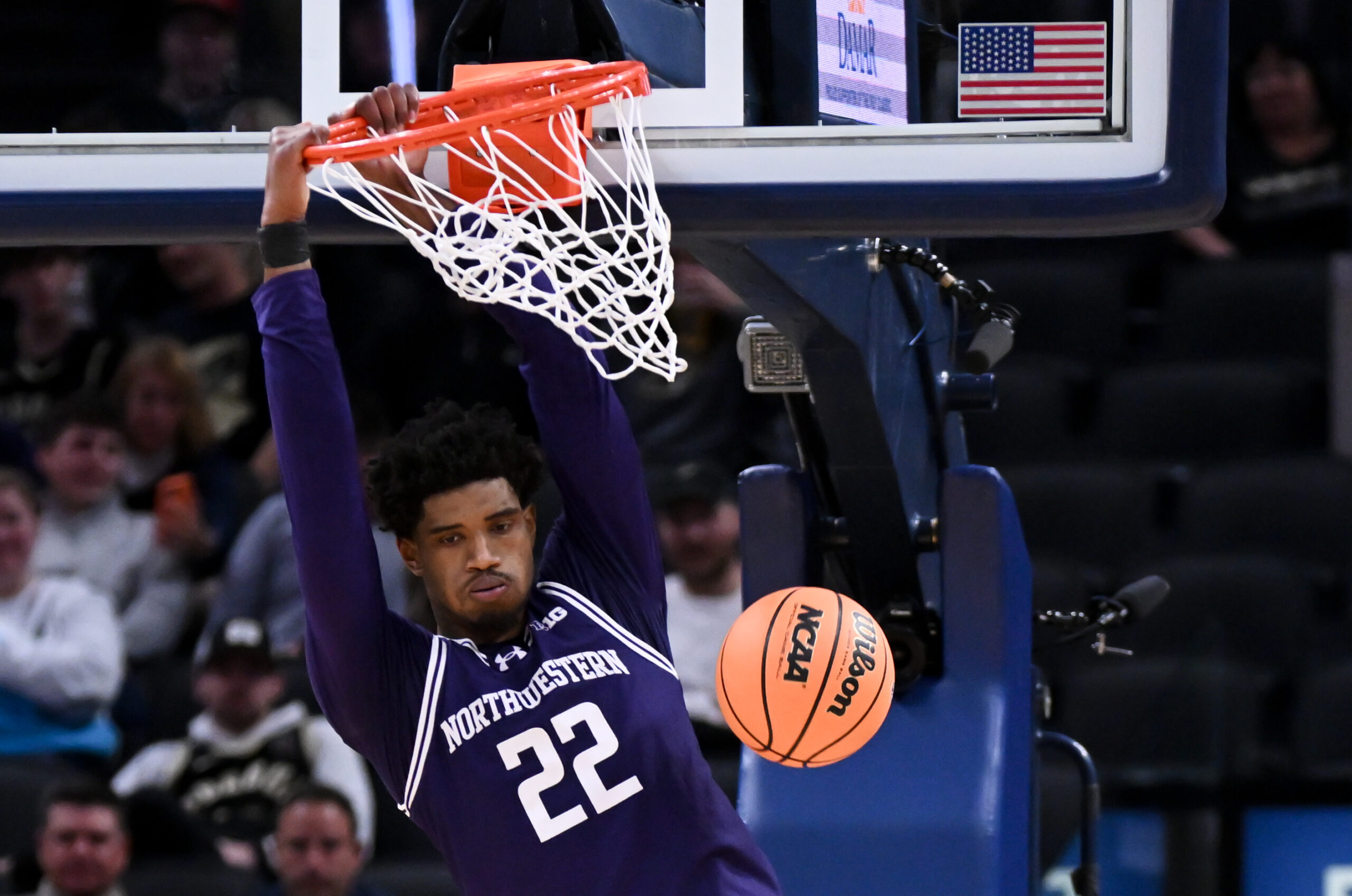 Dec 20, 2025; Indianapolis, Indiana, USA; Northwestern Wildcats forward Arrinten Page (22) dunks the ball during the second half against the Butler Bulldogs at Gainbridge Fieldhouse. Mandatory Credit: Robert Goddin-Imagn Images