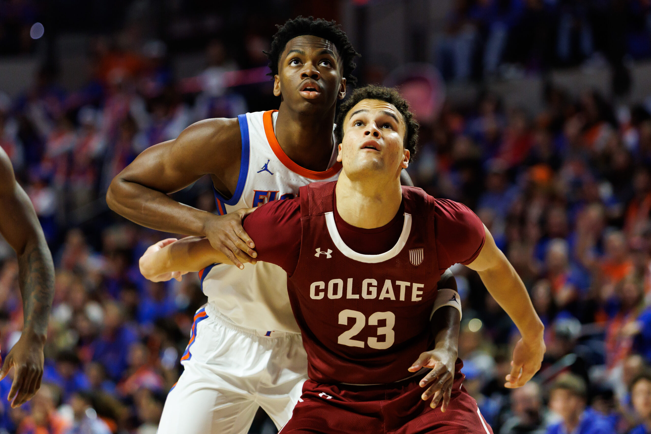 Dec 21, 2025; Gainesville, Florida, USA; Florida Gators guard CJ Ingram II (11) battles with Colgate Raiders forward Cooper Wright (23) for the rebound during the second half at Exactech Arena at the Stephen C. O'Connell Center. Mandatory Credit: Matt Pendleton-Imagn Images