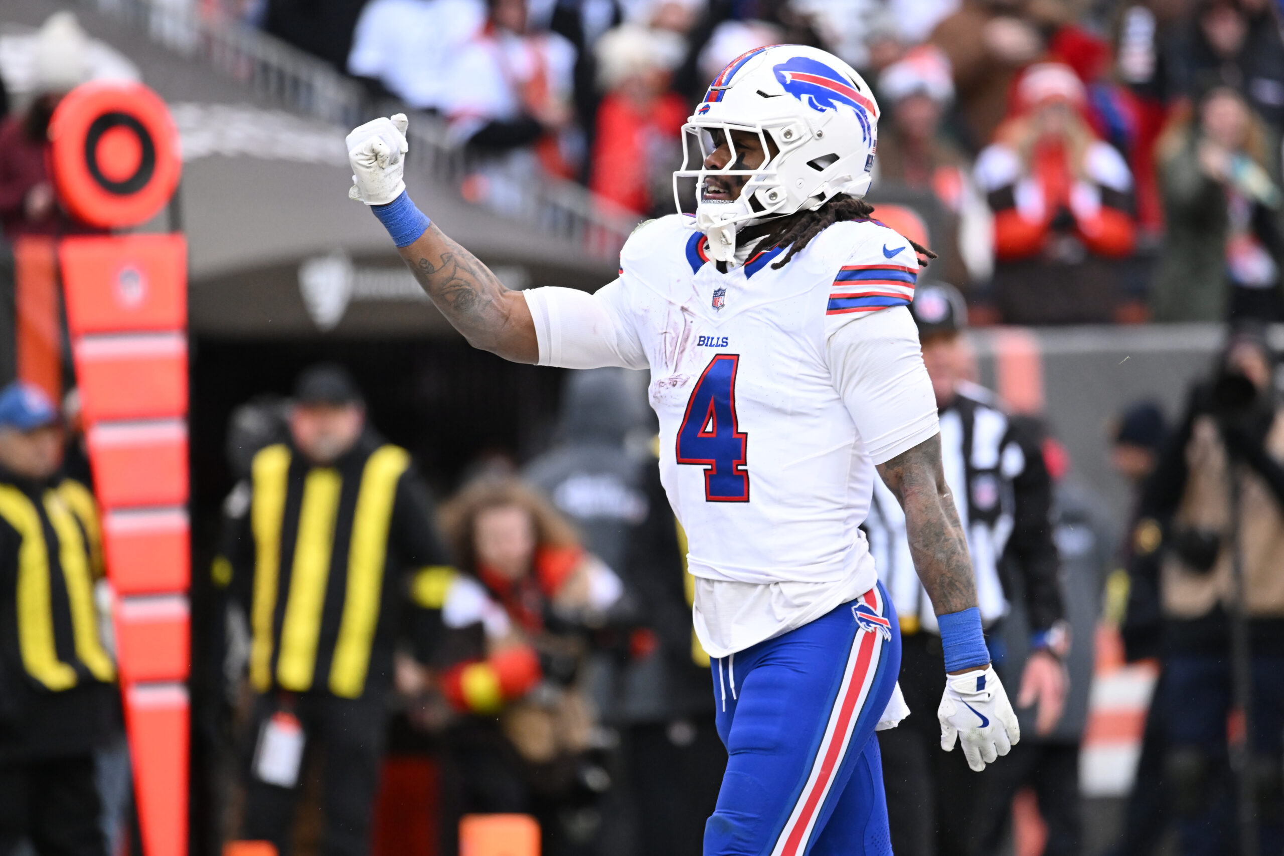 Dec 21, 2025; Cleveland, Ohio, USA;  Buffalo Bills running back James Cook III (4) reacts after scoring a touchdown against the Cleveland Browns during the first half at Huntington Bank Field. Mandatory Credit: Ken Blaze-Imagn Images
