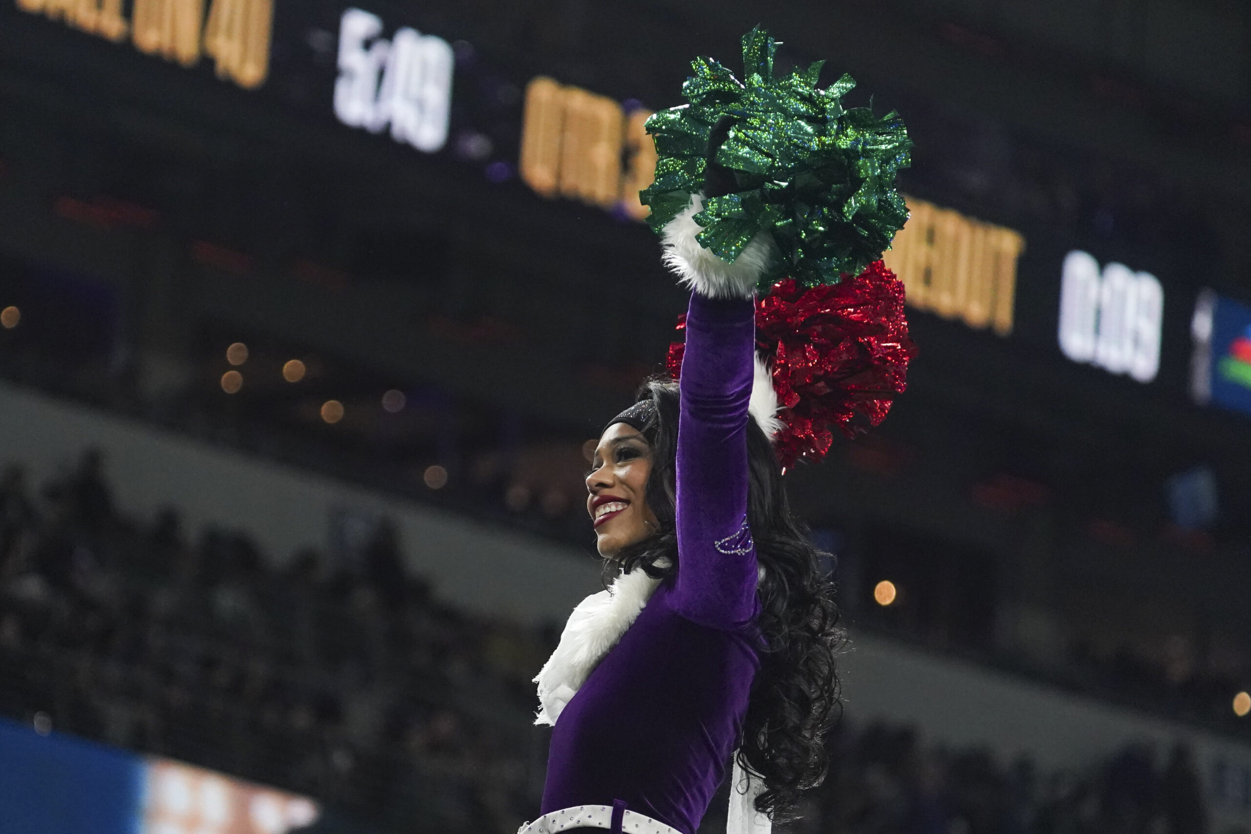Dec 21, 2025; Baltimore, Maryland, USA;  A Baltimore Ravens cheerleader performs during the second half of the game against the New England Patriots at M&T Bank Stadium. Mandatory Credit: James Lang-Imagn Images