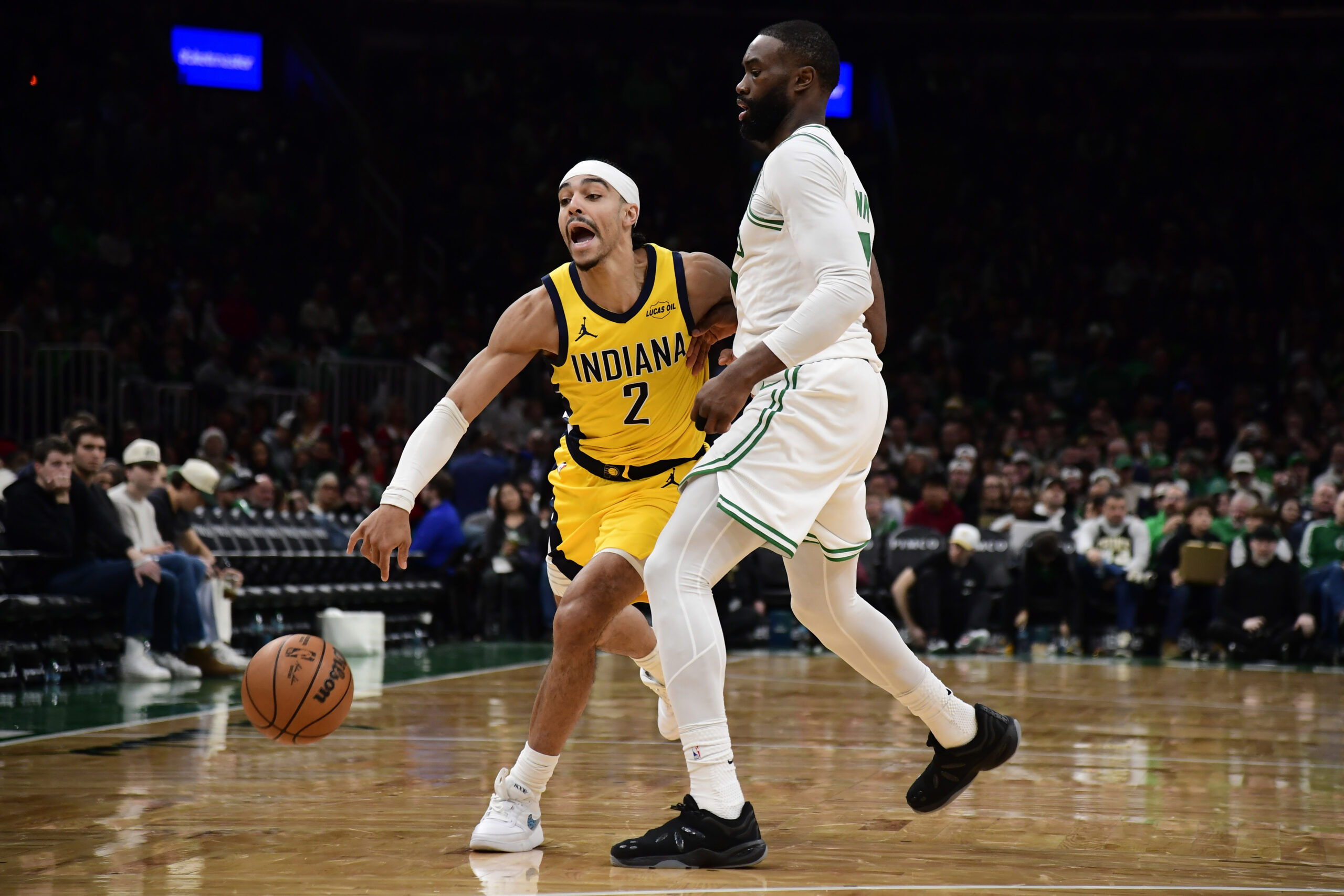Dec 22, 2025; Boston, Massachusetts, USA; Boston Celtics guard Jaylen Brown (7) defends Indiana Pacers guard Andrew Nembhard (2) during the second half at TD Garden. Mandatory Credit: Bob DeChiara-Imagn Images