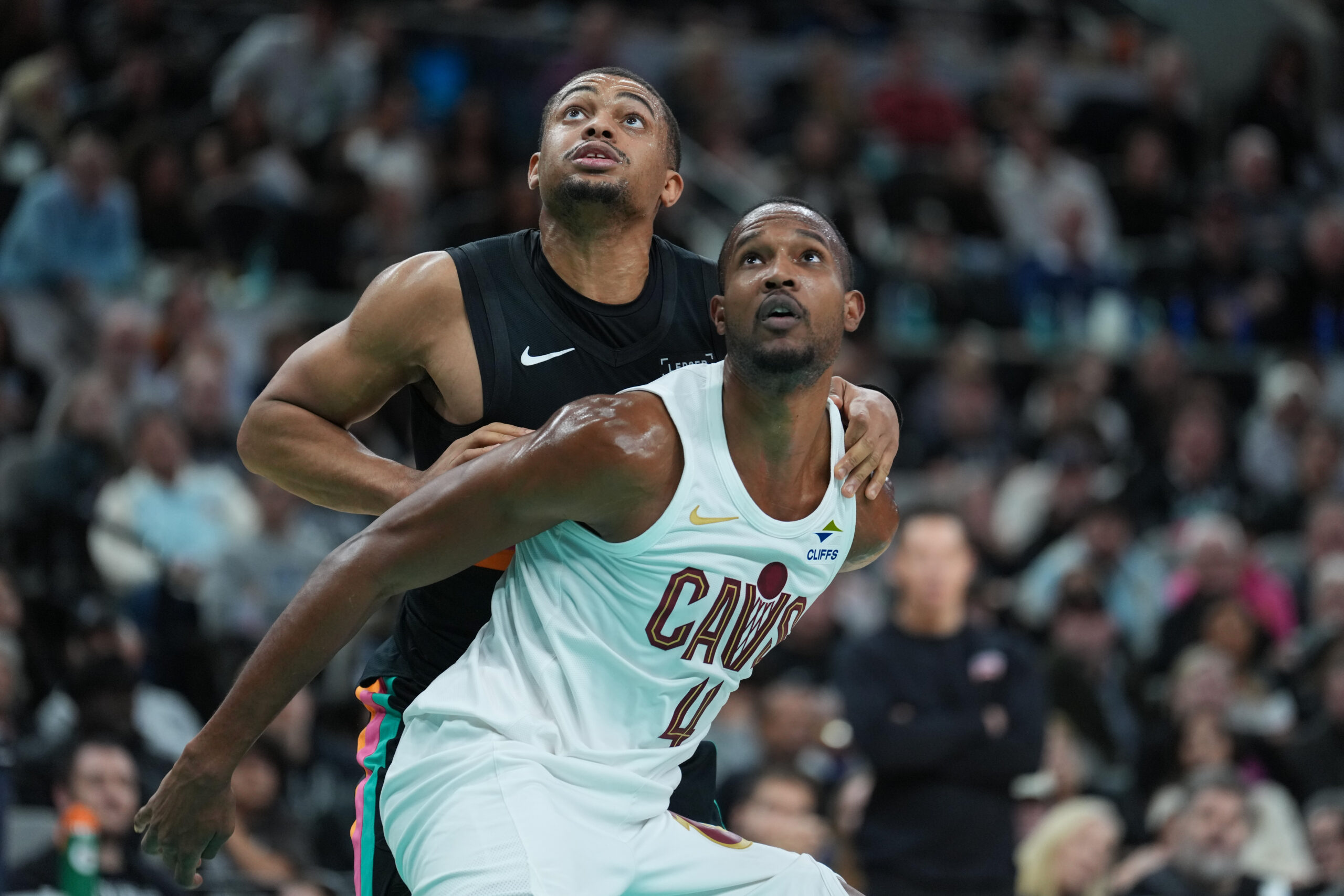 Dec 29, 2025; San Antonio, Texas, USA;  Cleveland Cavaliers center Evan Mobley (4) blocks out San Antonio Spurs forward Keldon Johnson (3) in the second half at Frost Bank Center. Mandatory Credit: Daniel Dunn-Imagn Images