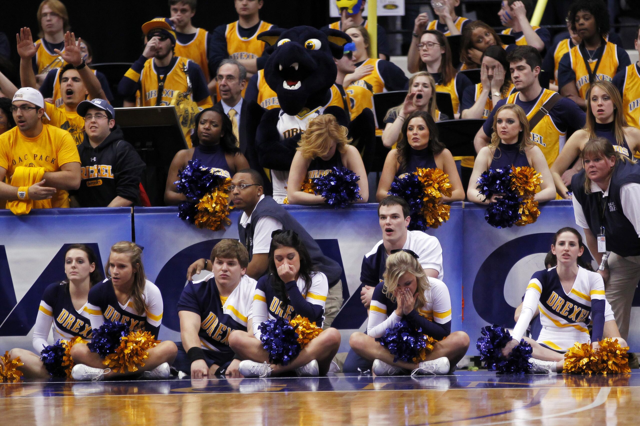 March 5, 2012; Richmond, VA USA; Drexel Dragons cheerleaders watch form the stands against the Virginia Commonwealth Rams in the closing seconds of the second half of the championship game of the 2012 Colonial Athletic Association Tournament at the Richmond Coliseum. The Rams won 59-56. Mandatory Credit: Geoff Burke-Imagn Images