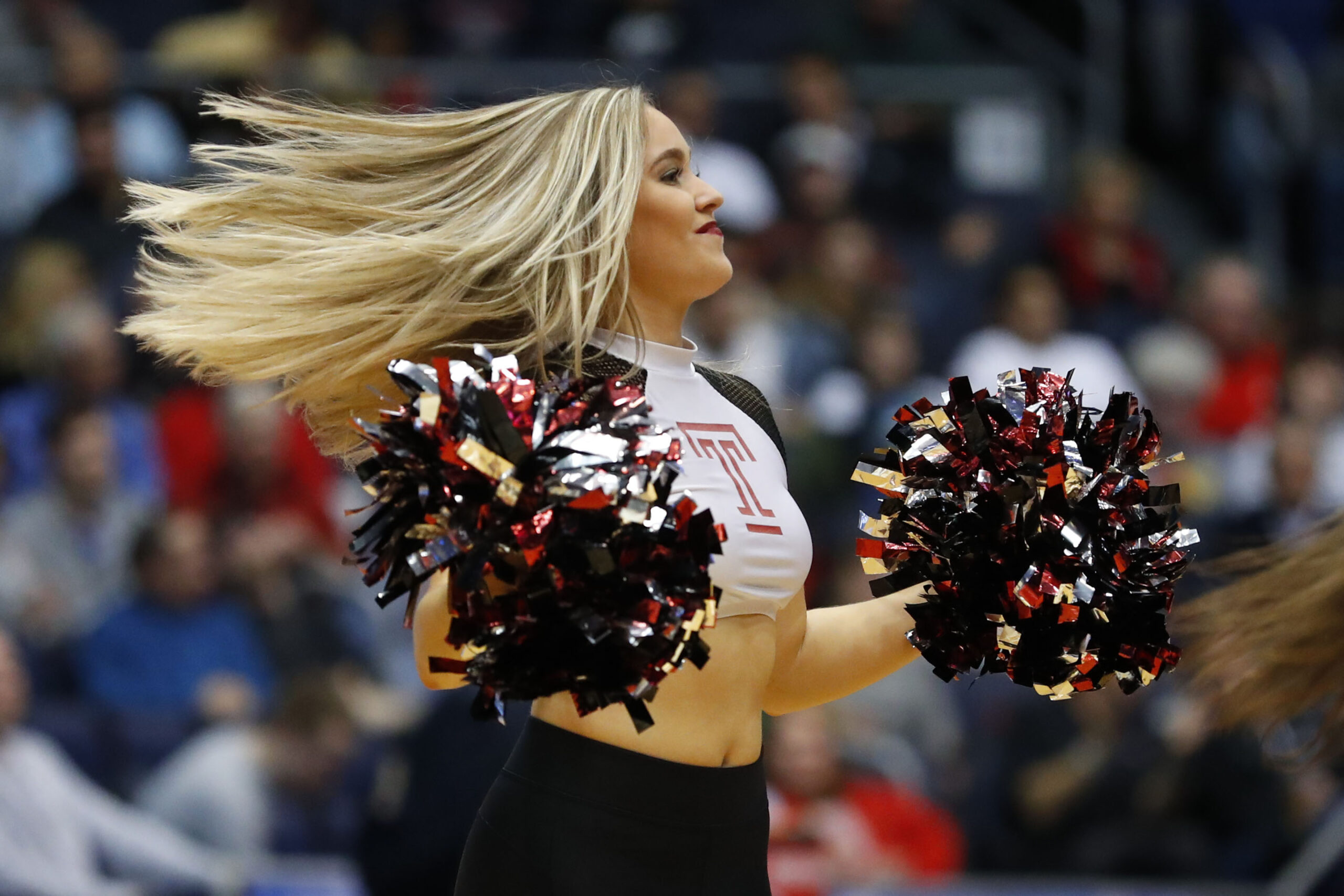 Mar 19, 2019; Dayton, OH, USA; Temple Owls cheerleader in the first half against the Belmont Bruins in the First Four of the 2019 NCAA Tournament at Dayton Arena. Mandatory Credit: Rick Osentoski-Imagn Images