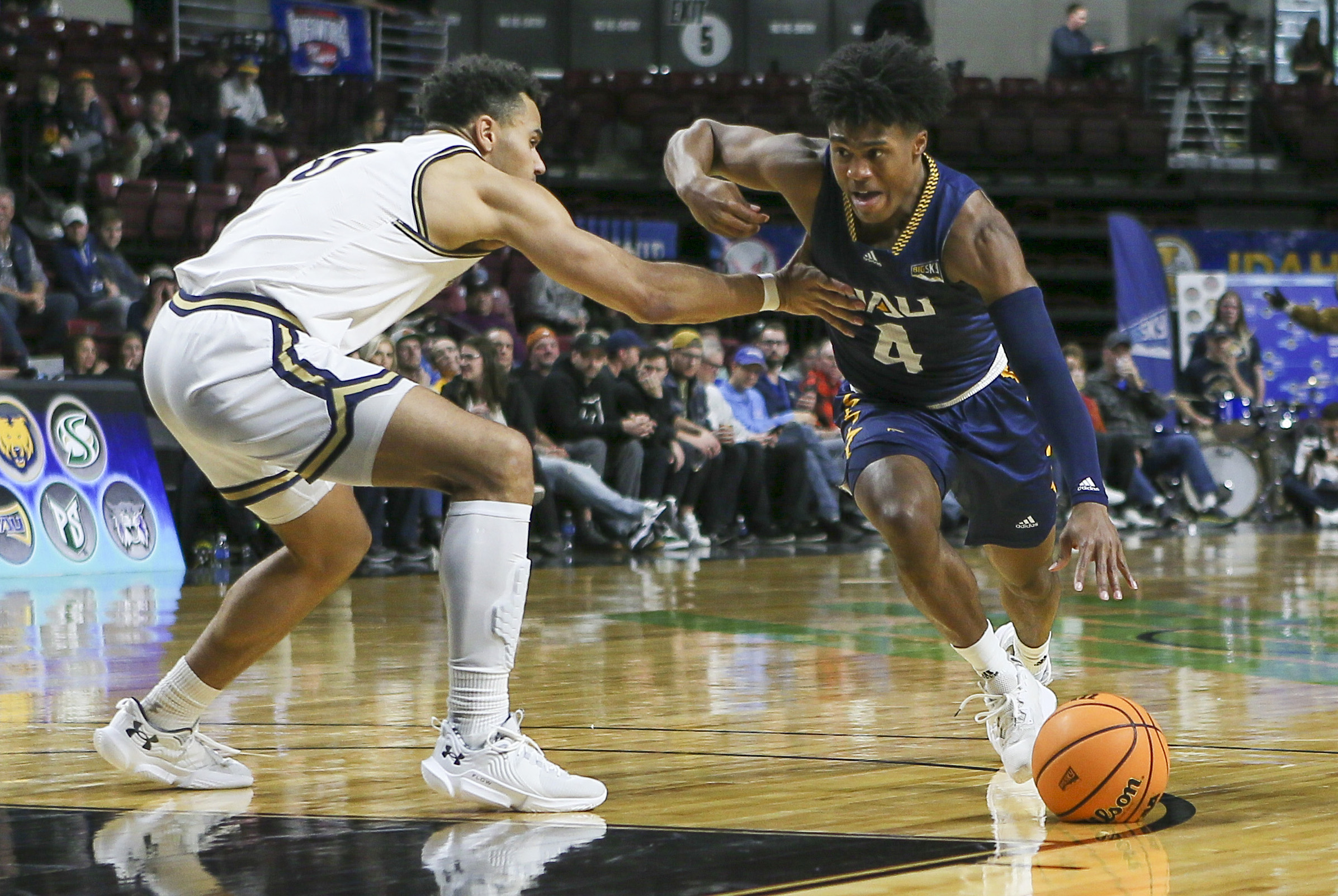 Mar 8, 2023; Boise, ID, USA; Northern Arizona Lumberjacks guard Oakland Fort (4) drives during the second half against Montana State Bobcats at Idaho Central Arena. Montana State defeated Northern Arizona 85-78. Mandatory Credit: Brian Losness-Imagn Images