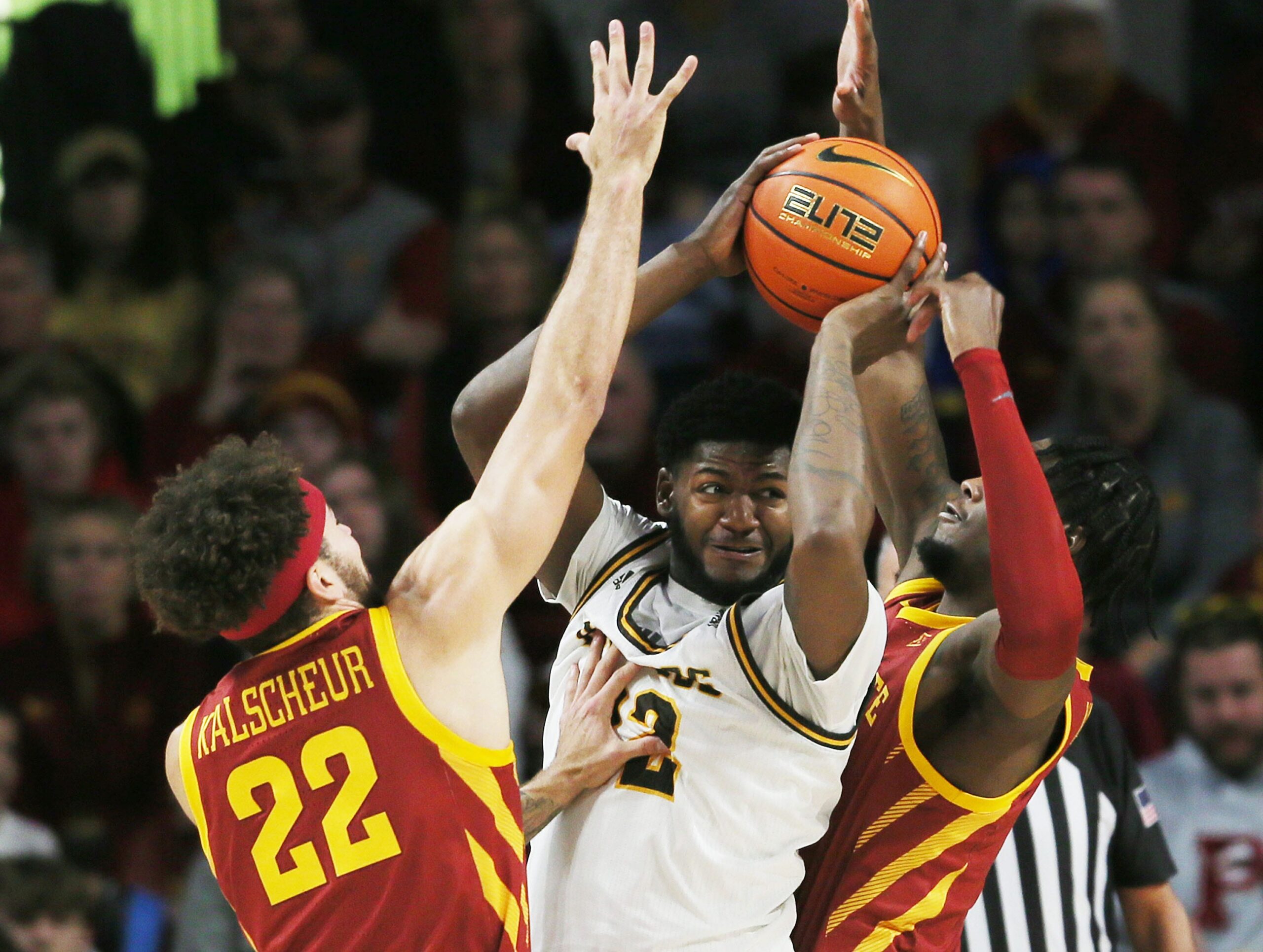 Iowa State University Cyclones guard Gabe Kalscheur (22) and forward Tre King (0) defend as Western Michigan Broncos center Titus Wright (22) looks for a pass during the first half at Hilton Coliseum Sunday, Dec.18, 2022, in Ames, Iowa. Photo by Nirmalendu Majumdar/Ames Tribune

Western Michigan And Iowa State Men S Basketball
