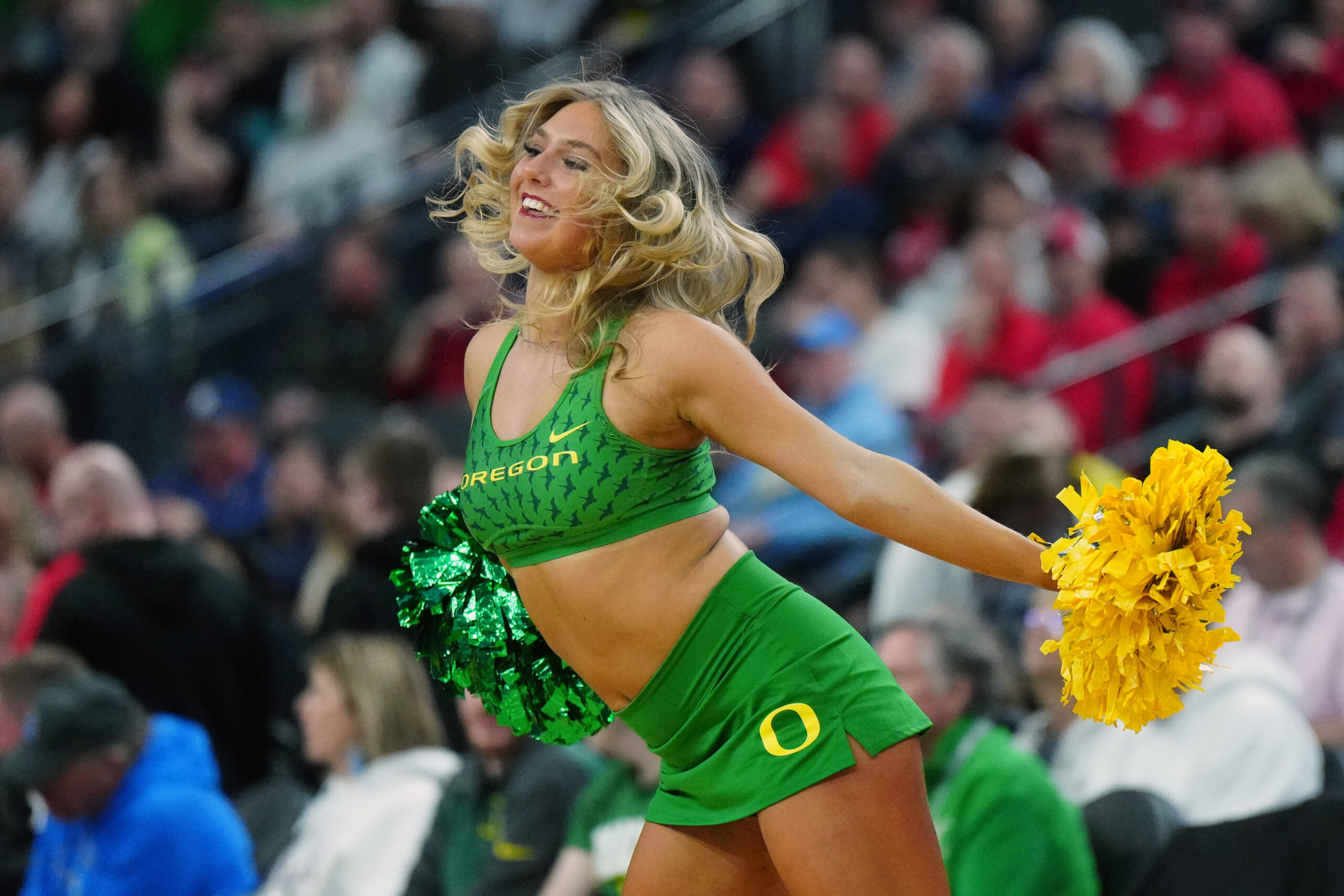 Mar 14, 2024; Las Vegas, NV, USA; Oregon Ducks cheerleaders perform in the first half against the UCLA Bruins at T-Mobile Arena. Mandatory Credit: Kirby Lee-Imagn Images