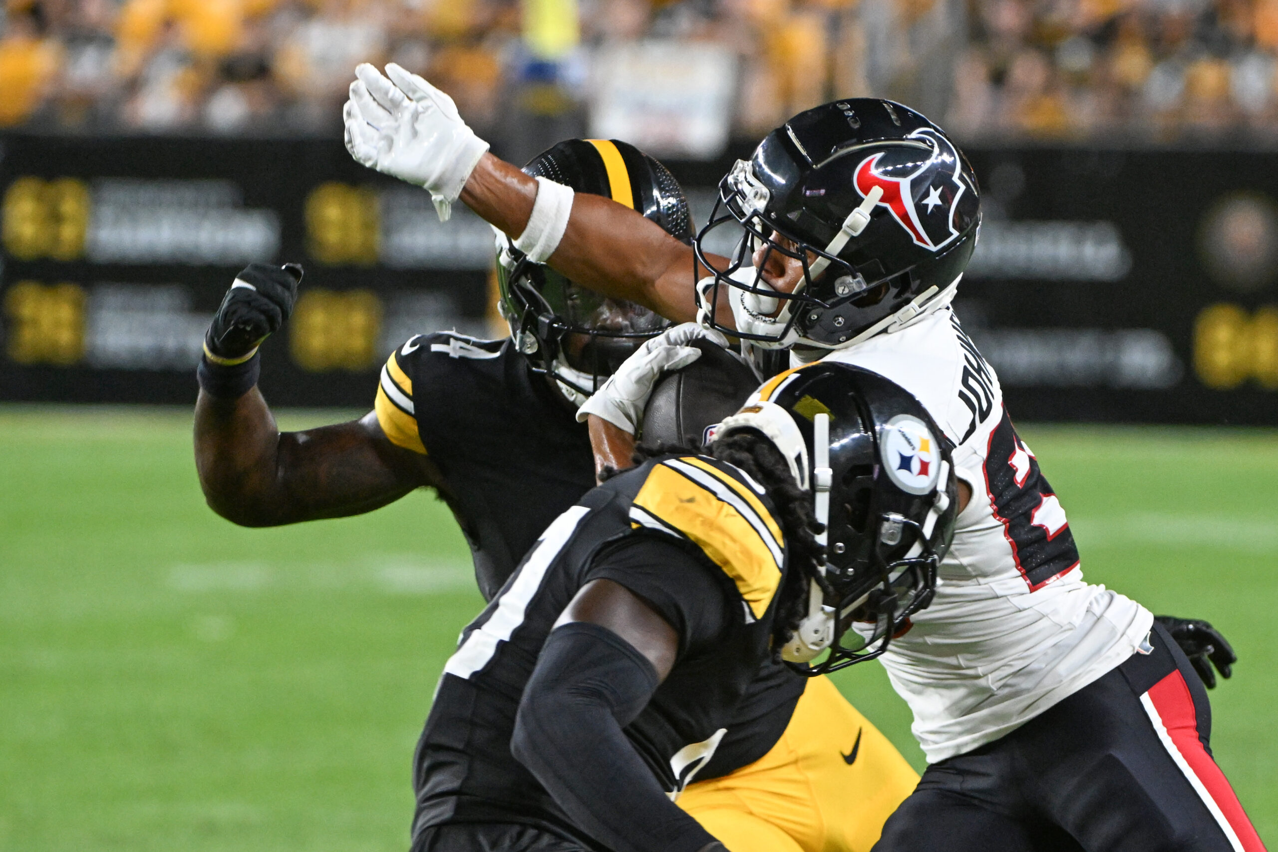 Aug 9, 2024; Pittsburgh, Pennsylvania, USA;  Houston Texans wide receiver Johnny Johnson III (88) runs following a catch as Pittsburgh Steelers linebacker Easton Gibbs defends during the fourth quarter at Acrisure Stadium. Mandatory Credit: Barry Reeger-Imagn Images