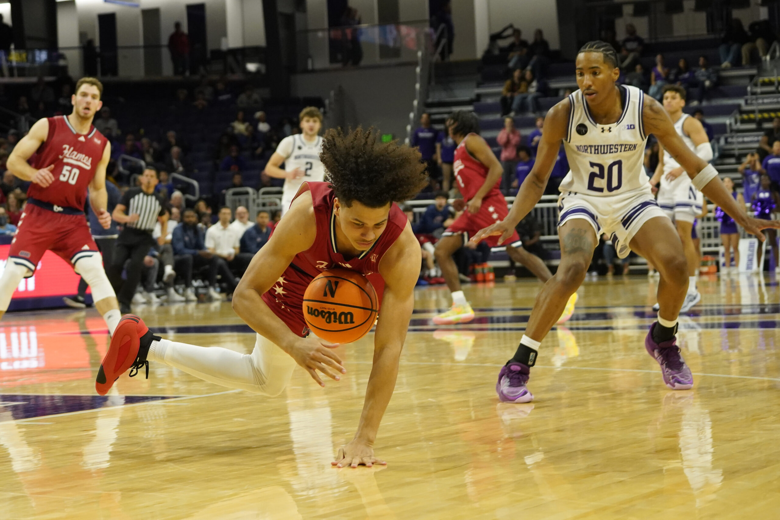 Nov 12, 2024; Evanston, Illinois, USA; Illinois-Chicago Flames guard Javon Jackson (22) steals the against the Northwestern Wildcats during the second half at Welsh-Ryan Arena. Mandatory Credit: David Banks-Imagn Images