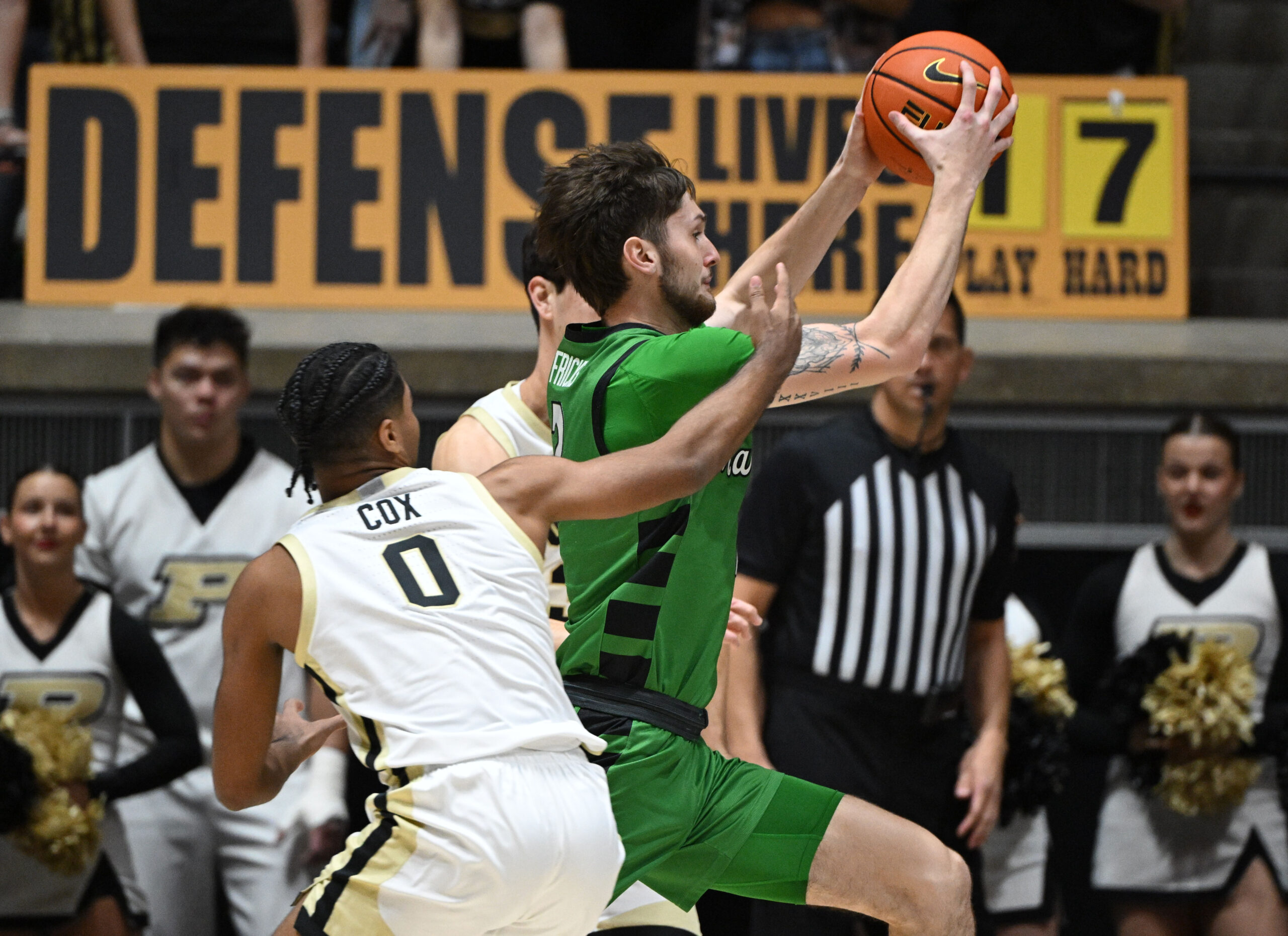 Nov 23, 2024; West Lafayette, Indiana, USA; Marshall Thundering Herd forward Wyatt Fricks (2) runs past Purdue Boilermakers guard C.J. Cox (0) during the second half at Mackey Arena. Mandatory Credit: Marc Lebryk-Imagn Images