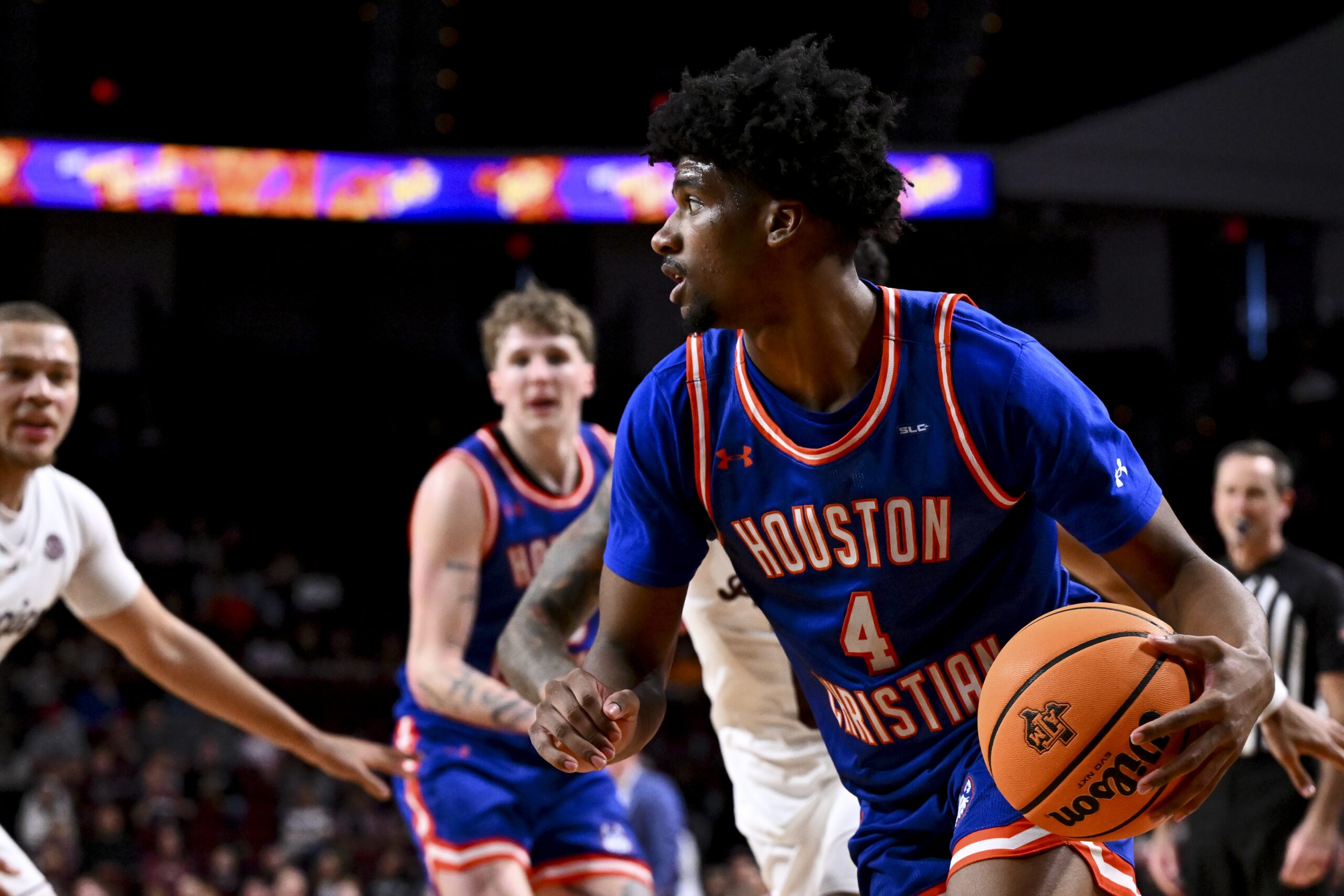 Dec 20, 2024; College Station, Texas, USA; Houston Christian Huskies guard Elijah Brooks (4) dribbles the ball during the second half against the Texas A&M Aggies at Reed Arena. The Aggies defeated the Huskies 77-45. Mandatory Credit: Maria Lysaker-Imagn Images