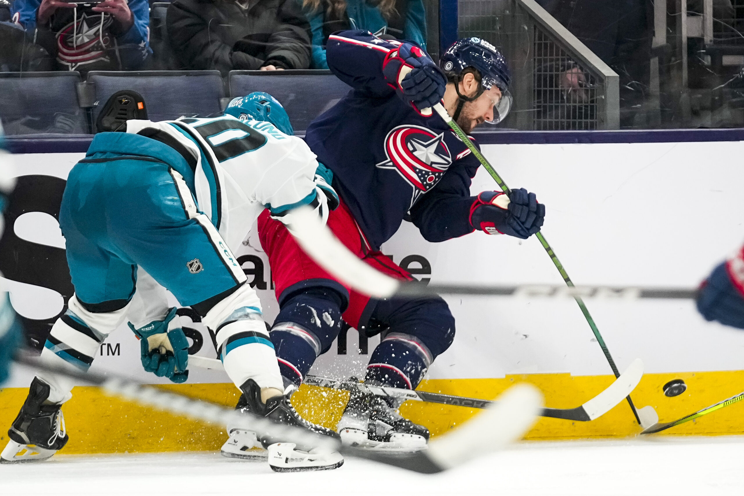 Jan 16, 2025; Columbus, Ohio, USA; Columbus Blue Jackets center Sean Kuraly (7) fights for the puck against the San Jose Sharks in the third period at Nationwide Arena on Thursday, Jan. 16, 2025 in Columbus, Ohio.   Mandatory Credit: Samantha Madar/USA TODAY Network via Imagn Images