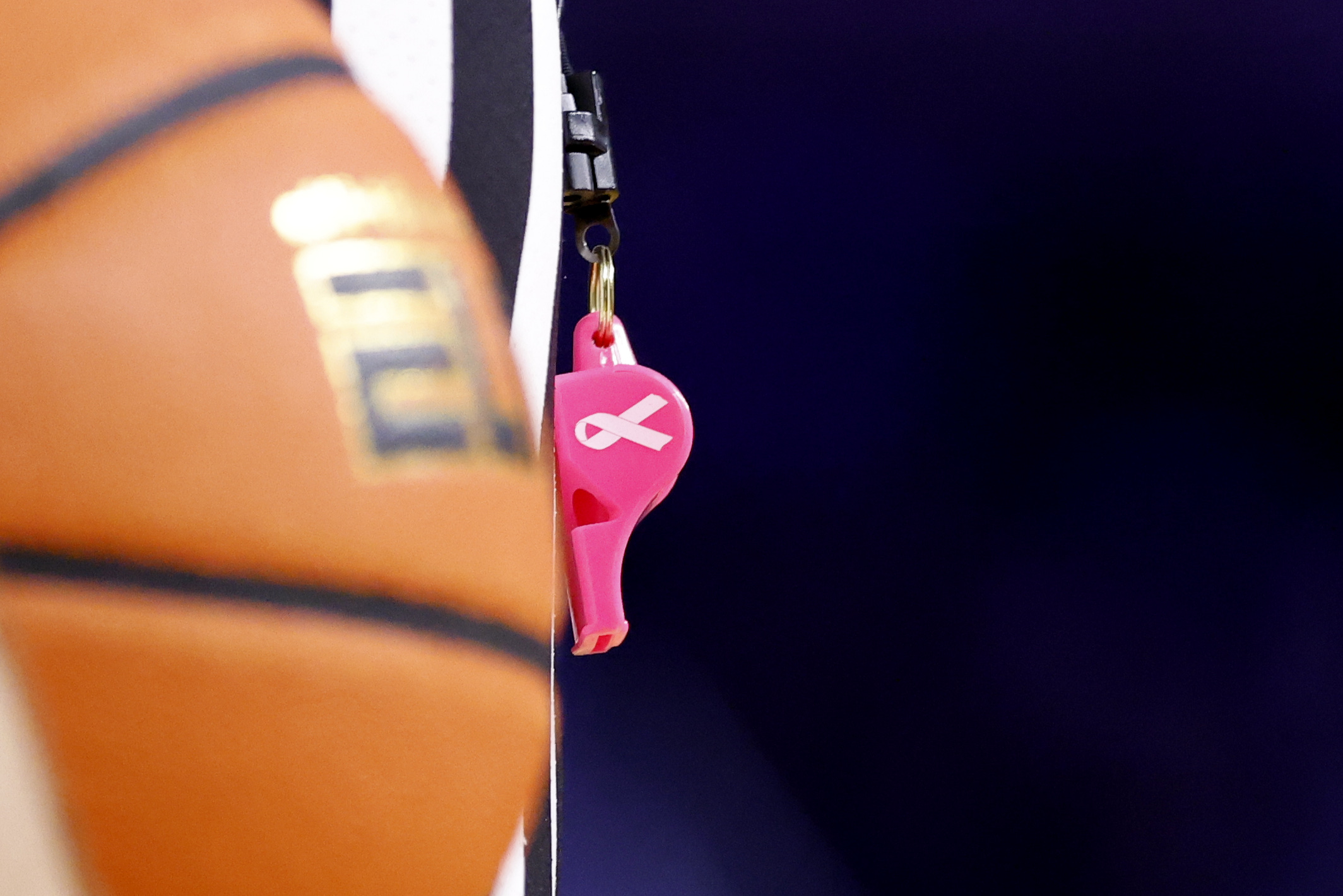 Jan 27, 2025; Ann Arbor, Michigan, USA;  Referees use pink whistles during the game between the Michigan Wolverines and the Penn State Nittany Lions at Crisler Center. Mandatory Credit: Rick Osentoski-Imagn Images