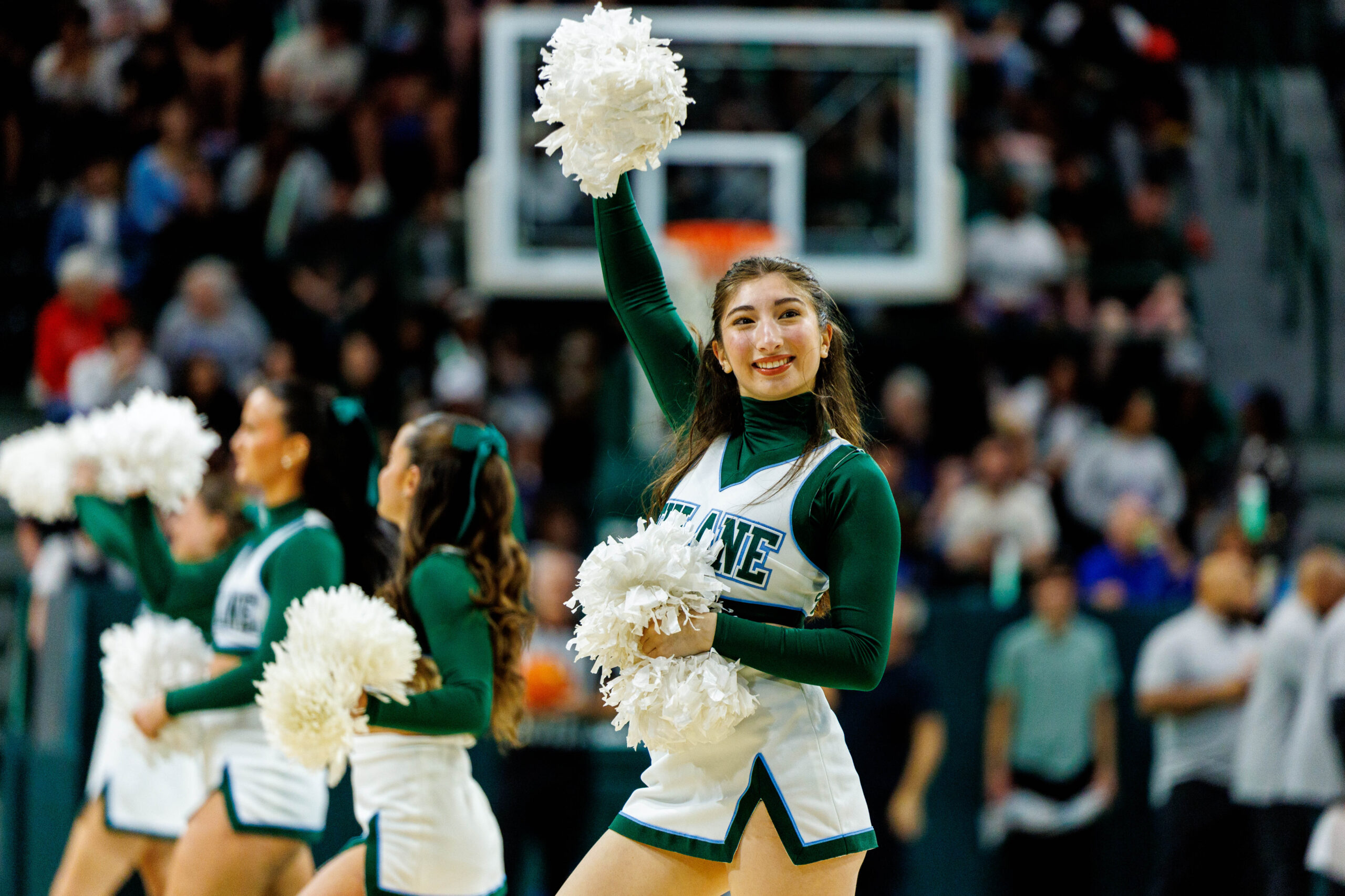 Jan 30, 2025; New Orleans, Louisiana, USA; Tulane Green Wave cheerleaders perform on a time out against the Memphis Tigers during the second half at Avron B. Fogelman Arena in Devlin Fieldhouse. Mandatory Credit: Stephen Lew-Imagn Images