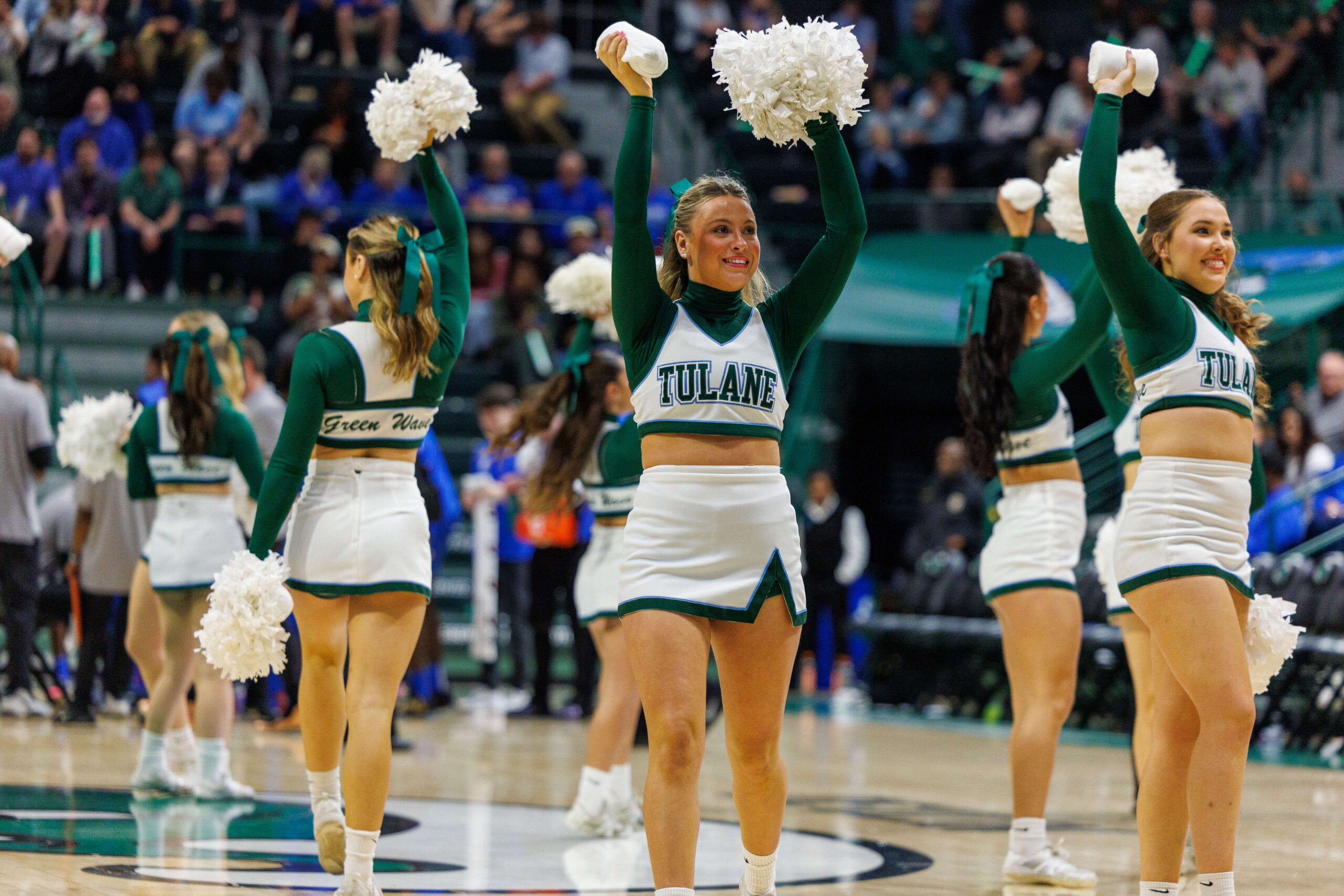 Jan 30, 2025; New Orleans, Louisiana, USA; Tulane Green Wave cheerleaders perform on a time out against the Memphis Tigers during the second half at Avron B. Fogelman Arena in Devlin Fieldhouse. Mandatory Credit: Stephen Lew-Imagn Images