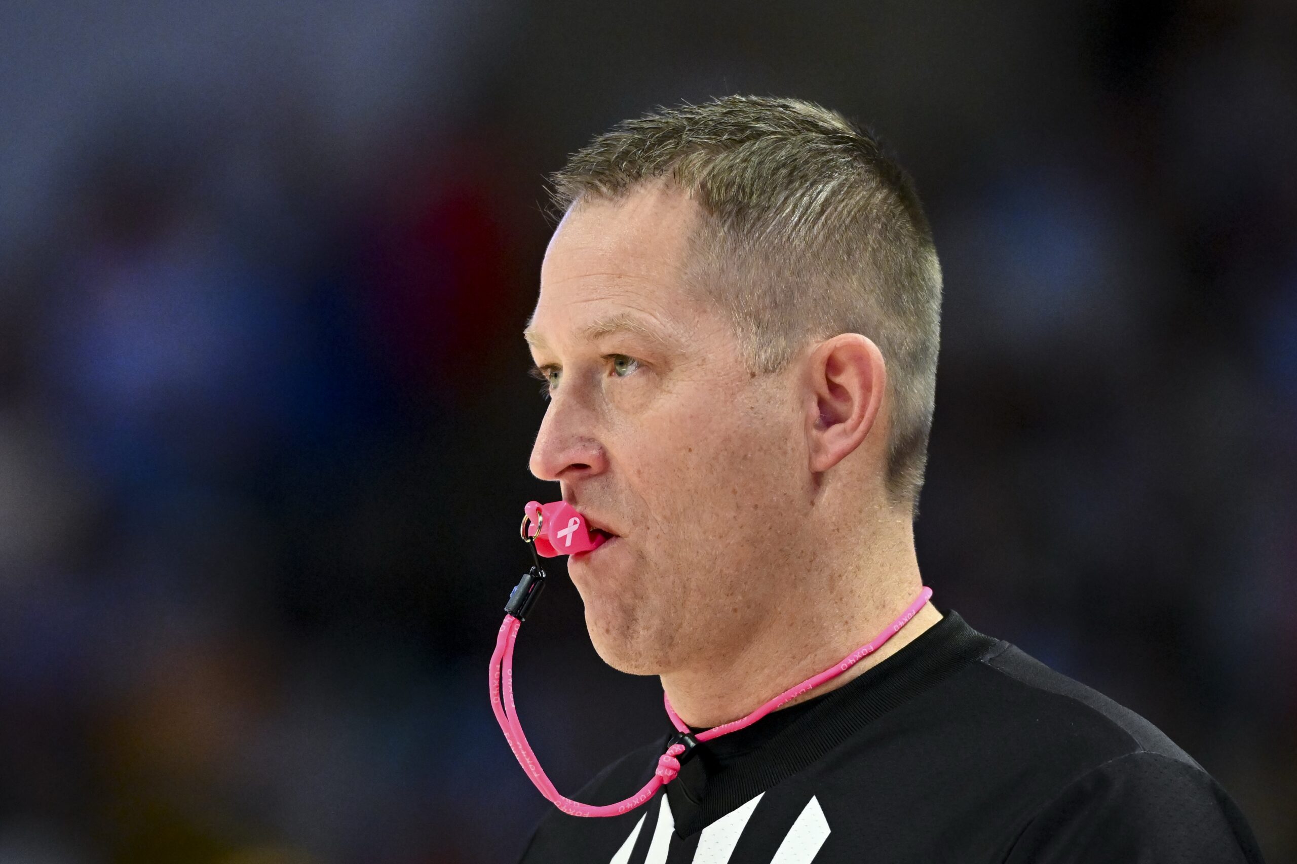 Feb 1, 2025; Houston, Texas, USA; A detailed view of a cancer awareness whistle on referee Tyler Kumpf during the game between the Houston Cougars and the Texas Tech Red Raiders at Fertitta Center. Mandatory Credit: Maria Lysaker-Imagn Images