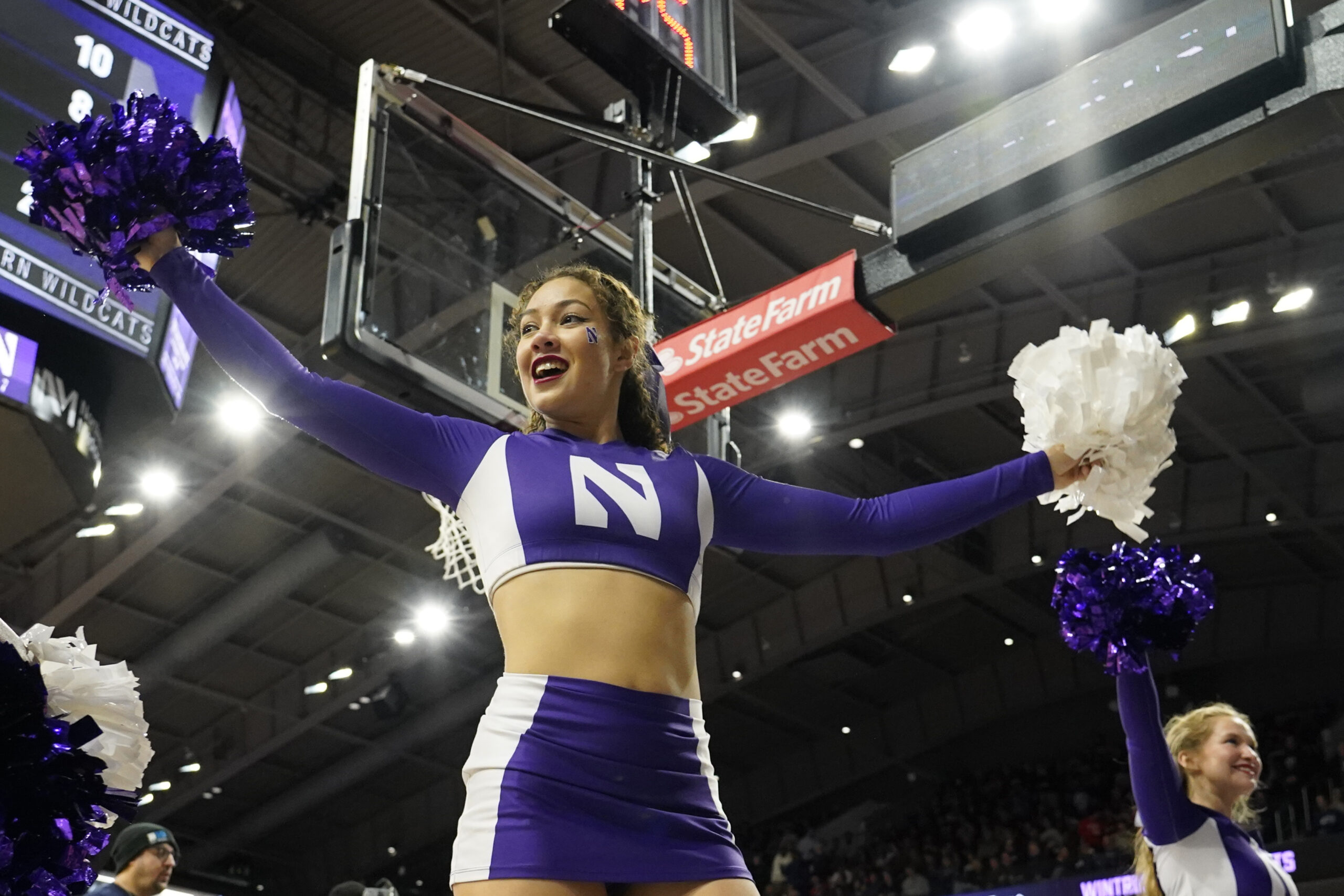 Feb 16, 2025; Evanston, Illinois, USA; A Northwestern Wildcats cheerleader performs during the second half at Welsh-Ryan Arena. Mandatory Credit: David Banks-Imagn Images