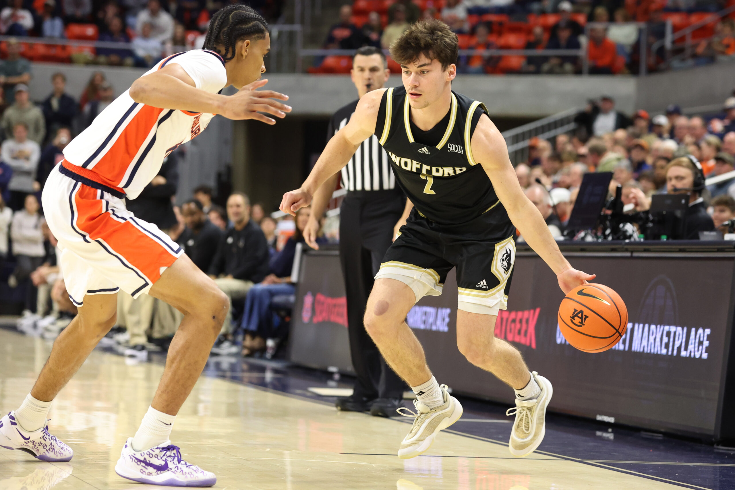 Nov 11, 2025; Auburn, Alabama, USA;  Auburn Tigers guard Elyjah Freeman (6) pressures Wofford Terriers forward Cannon Richards (7) during the first half at Neville Arena. Mandatory Credit: John Reed-Imagn Images