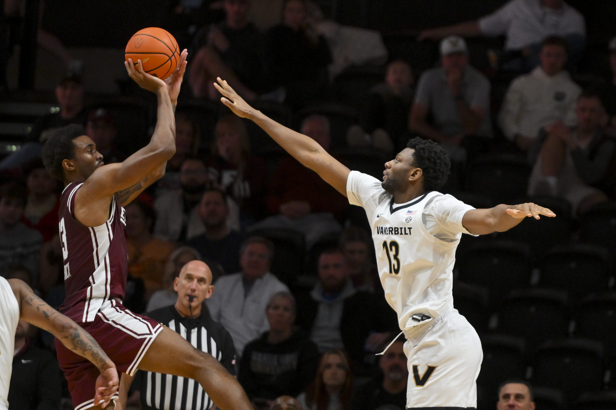 Nov 12, 2025; Nashville, Tennessee, USA;  Eastern Kentucky Colonels forward Montavious Myrick (13) shoots over  Vanderbilt Commodores forward Jalen Washington (13) during the second half at Memorial Gymnasium. Mandatory Credit: Steve Roberts-Imagn Images