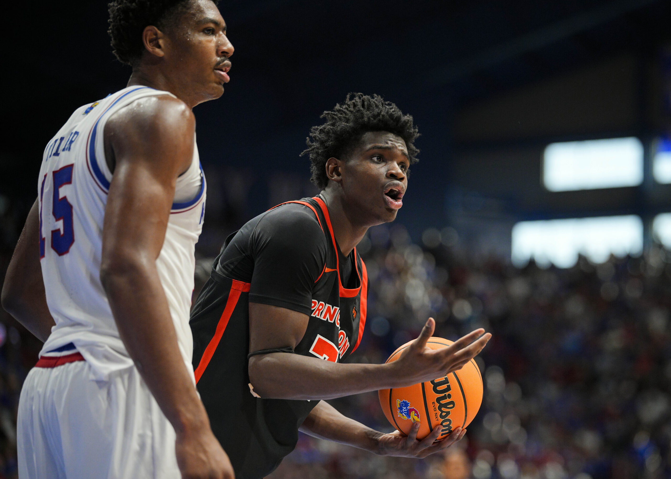 Nov 15, 2025; Lawrence, Kansas, USA; Princeton Tigers forward Malik Abdullahi (7) reacts after a foul call during the second half against the Kansas Jayhawks at Allen Fieldhouse. Mandatory Credit: Jay Biggerstaff-Imagn Images
