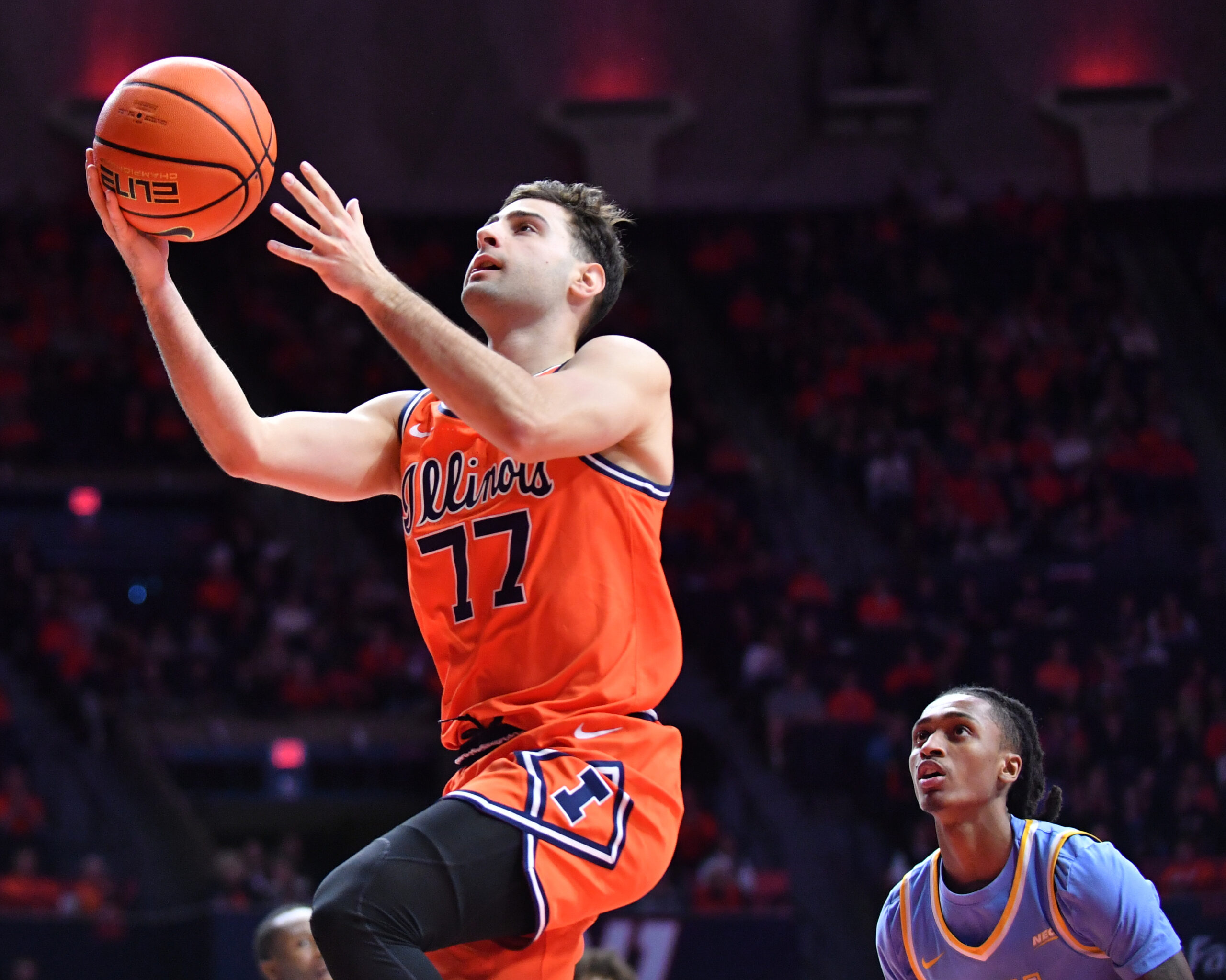 Nov 22, 2025; Champaign, Illinois, USA;  Illinois Fighting Illini guard Mihailo Petrovic (77) drives to the basket during the first half against the Long Island University Sharks at State Farm Center. Mandatory Credit: Ron Johnson-Imagn Images