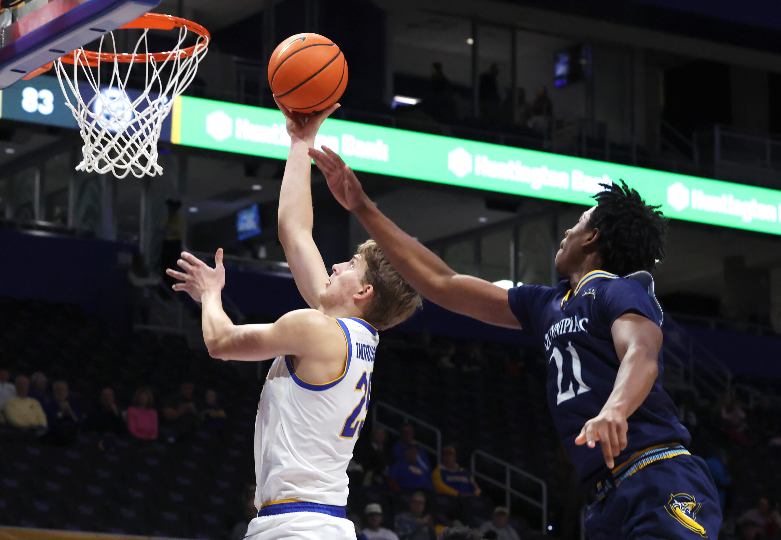 Nov 23, 2025; Pittsburgh, Pennsylvania, USA; Pittsburgh Panthers guard Nojus Indrusaitis (25) shoots against Quinnipiac Bobcats guard Keith Mcknight (21) during the second half at the Petersen Events Center. Mandatory Credit: Charles LeClaire-Imagn Images
