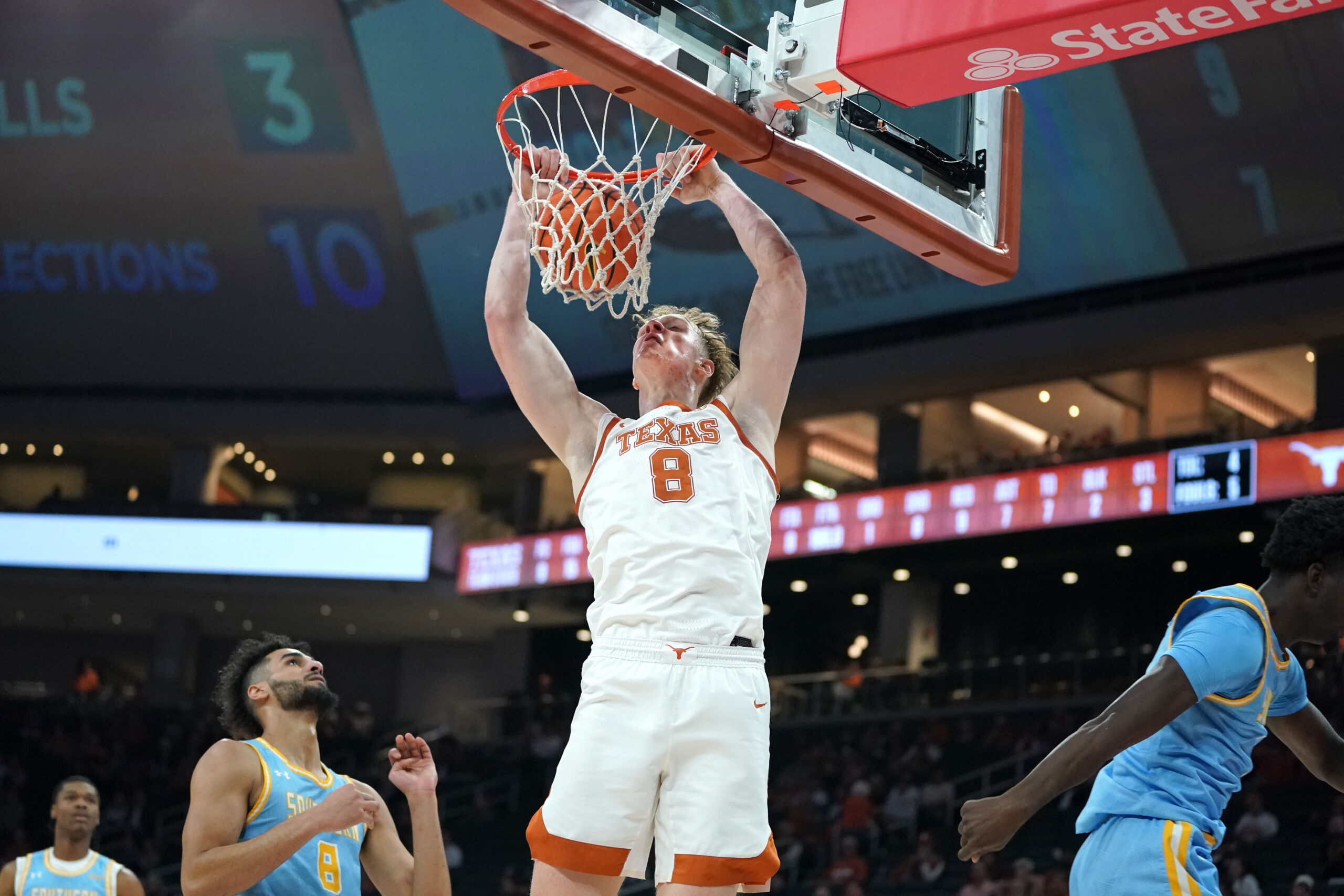 Dec 8, 2025; Austin, Texas, USA;  Texas Longhorns center Matas Vokietaitis (8) dunks the ball against Southern University Jaguars forward Malek Abdelgowad (8) during the first half at Moody Center. Mandatory Credit: Dustin Safranek-Imagn Images