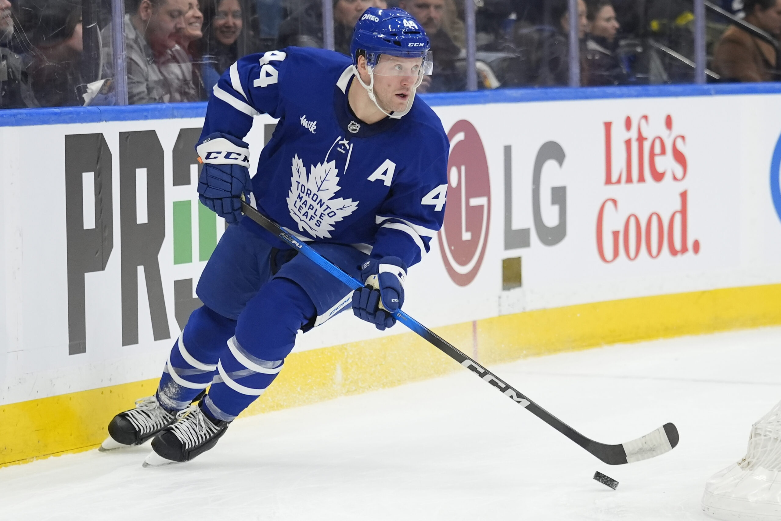 Dec 8, 2025; Toronto, Ontario, CAN; Toronto Maple Leafs defenseman Morgan Rielly (44) carries th epuck against the Tampa Bay Lightning during the second period at Scotiabank Arena. Mandatory Credit: John E. Sokolowski-Imagn Images