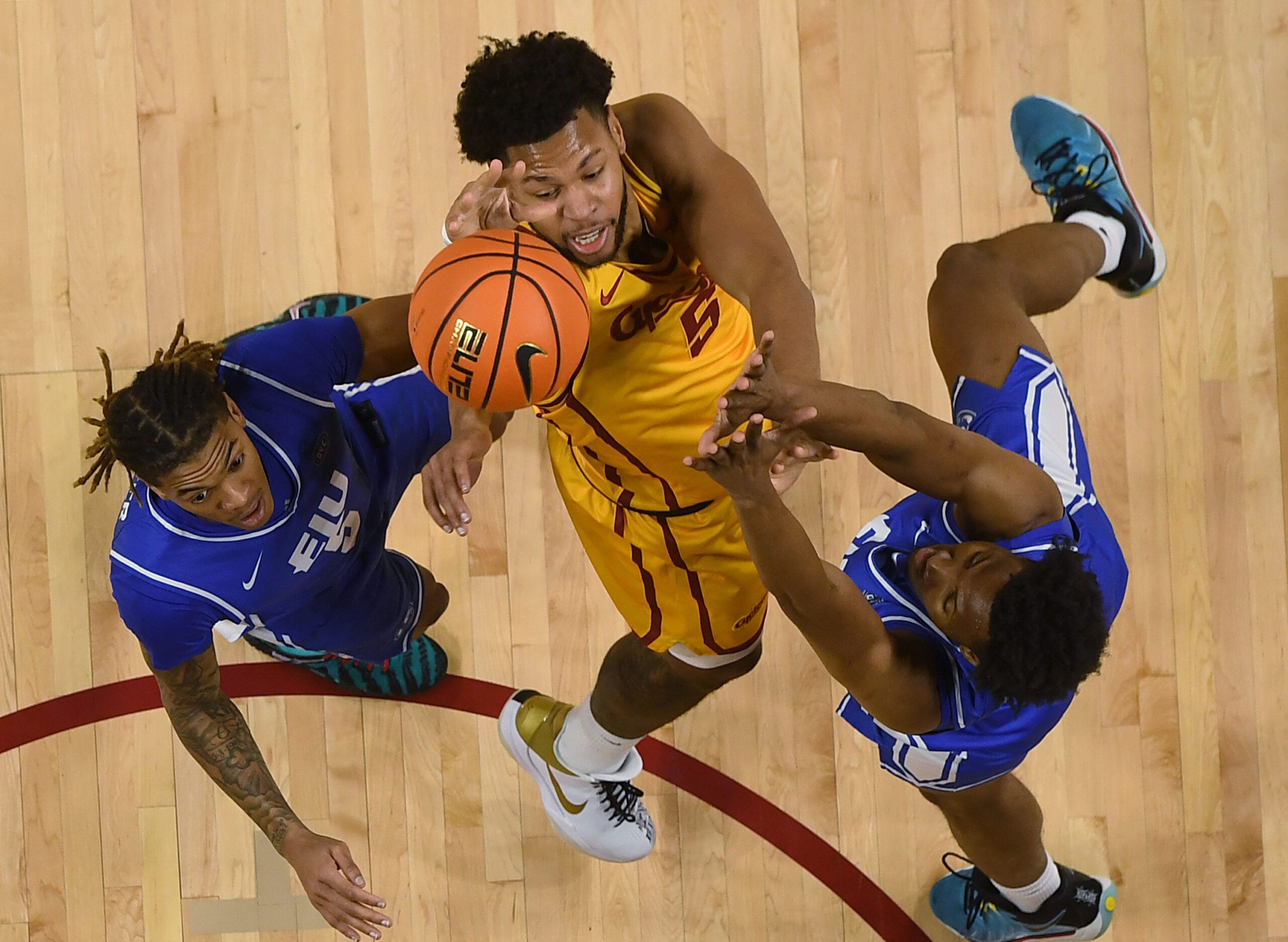 Iowa State Cyclones forward Joshua Jefferson (5) shoots the ball over the ball between Eastern Illinois Panthers guard Zion Fruster (5) and forward Naz Fisher (13) during the second half on December 14, 2025, at Hilton Coliseum in Ames, Iowa.