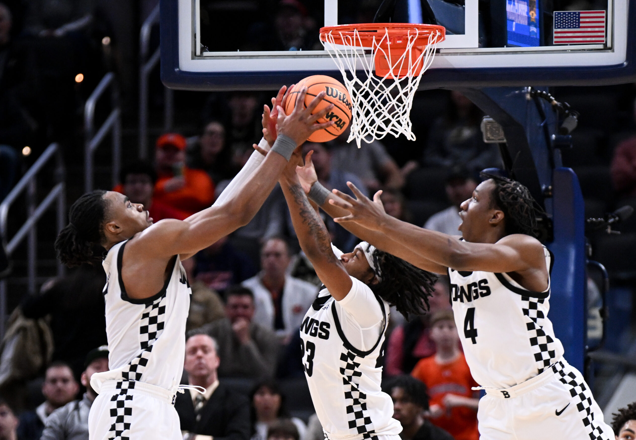 Dec 20, 2025; Indianapolis, Indiana, USA; Butler Bulldogs forward Michael Ajayi (5) and Butler Bulldogs guard Azavier Robinson (23) go for a rebound during the second half against the Northwestern Wildcats at Gainbridge Fieldhouse. Mandatory Credit: Robert Goddin-Imagn Images