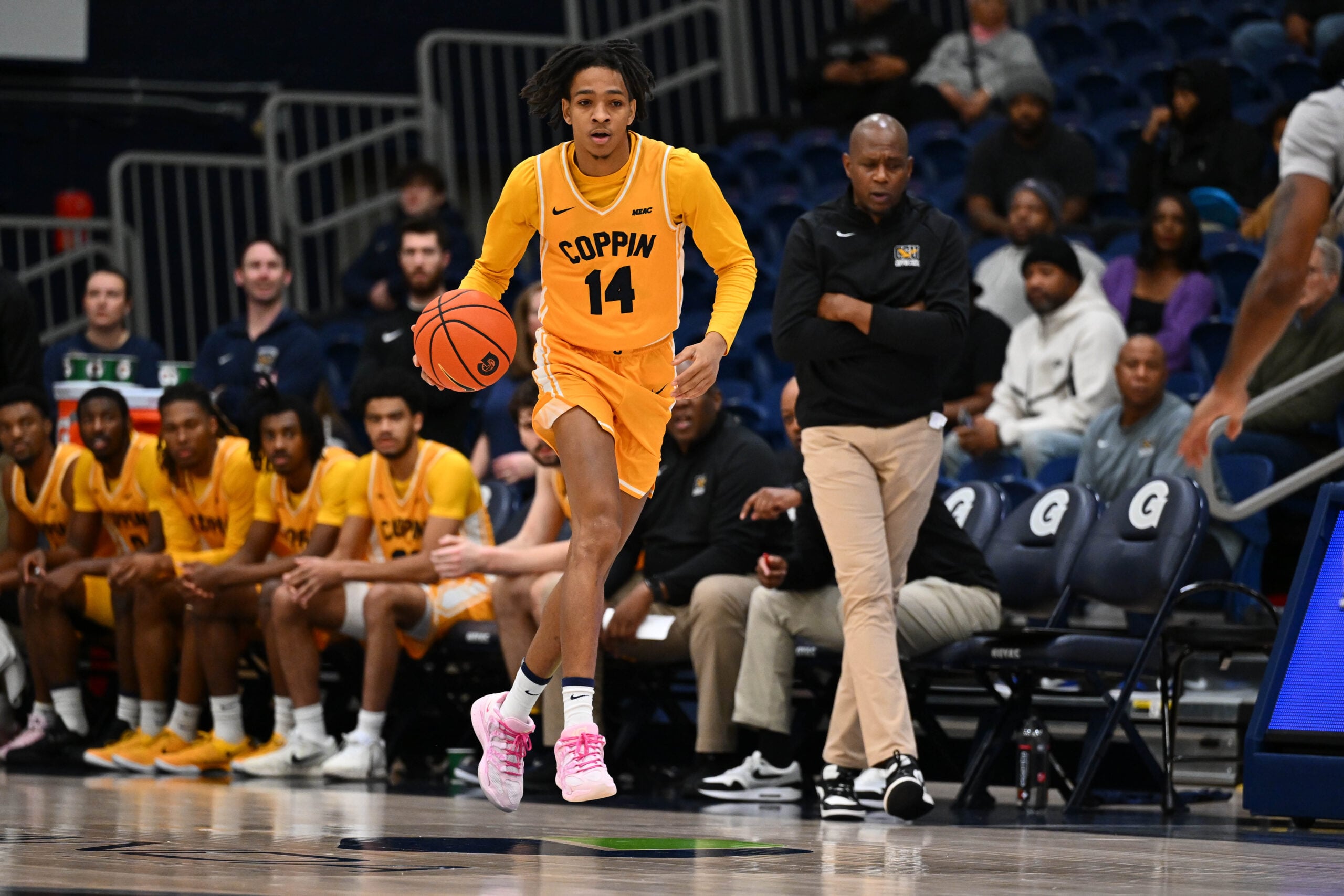 Dec 22, 2025; Washington, District of Columbia, USA; Coppin State Eagles guard Jamari Piercy (14) advances the ball against the Georgetown Hoyas during the first half at McDonough Arena. Mandatory Credit: Brad Mills-Imagn Images
