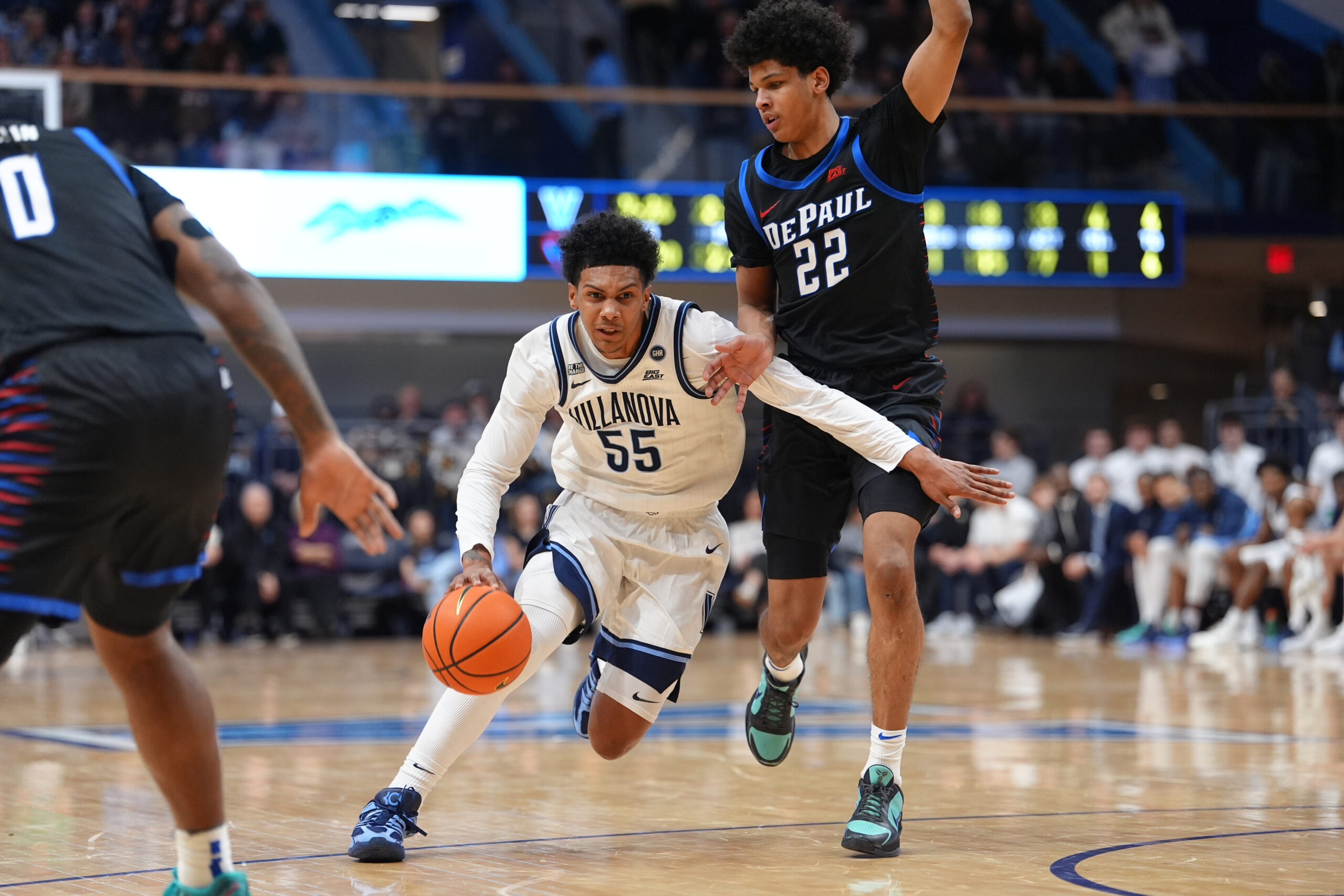Dec 31, 2025; Villanova, Pennsylvania, USA; Villanova Wildcats guard Acaden Lewis (55) drives against DePaul Blue Demons guard Kruz McClure (22) in the first half at William B. Finneran Pavilion. Mandatory Credit: Kyle Ross-Imagn Images