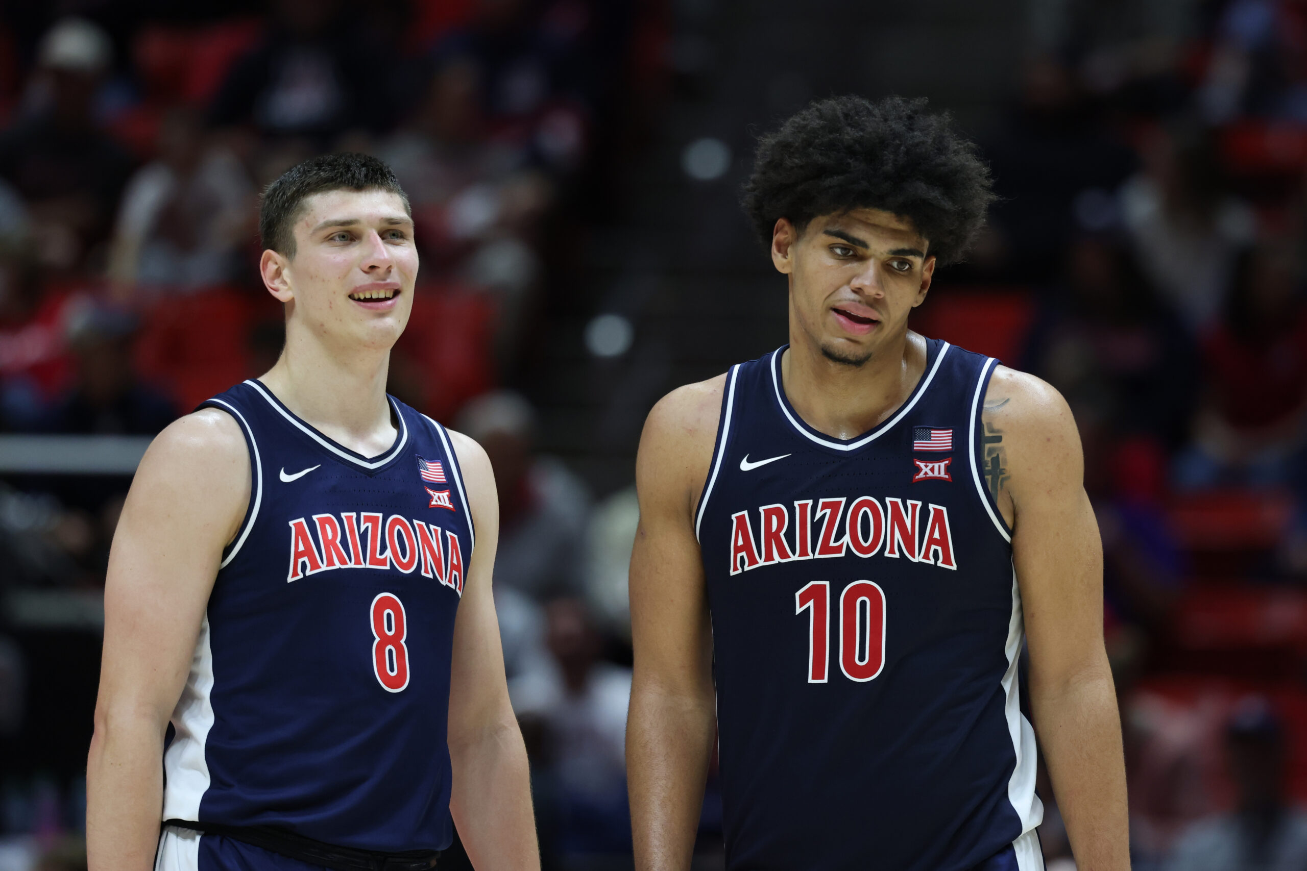 Jan 3, 2026; Salt Lake City, Utah, USA; Arizona Wildcats forward Ivan Kharchenkov (8) and forward Koa Peat (10) wait for play to resume after a time in the the second half of the game against the Utah Utes at Jon M. Huntsman Center. Mandatory Credit: Rob Gray-Imagn Images