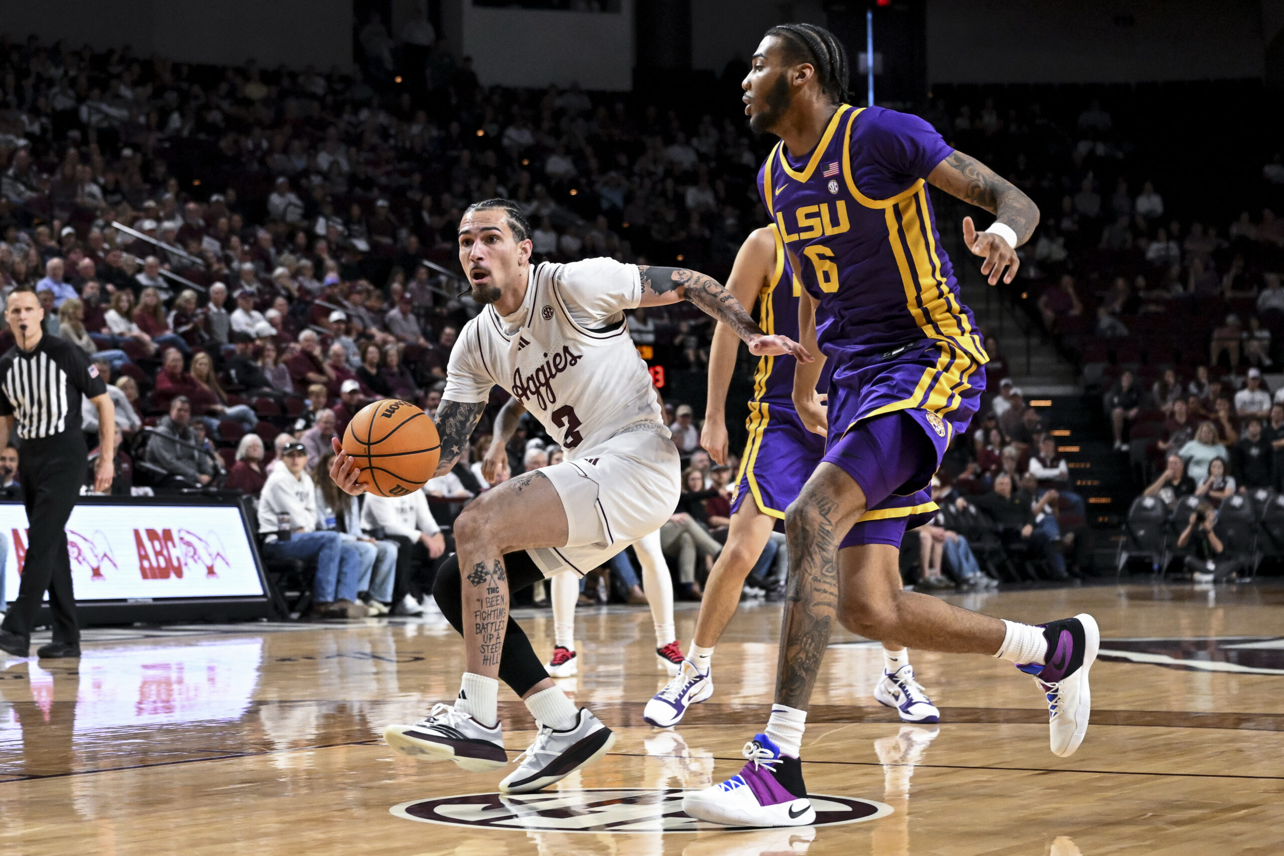 Jan 3, 2026; College Station, Texas, USA; Texas A&M Aggies guard Pop Isaacs (2) drives to the basket against the Louisiana State Tigers at Reed Arena. Mandatory Credit: Maria Lysaker-Imagn Images