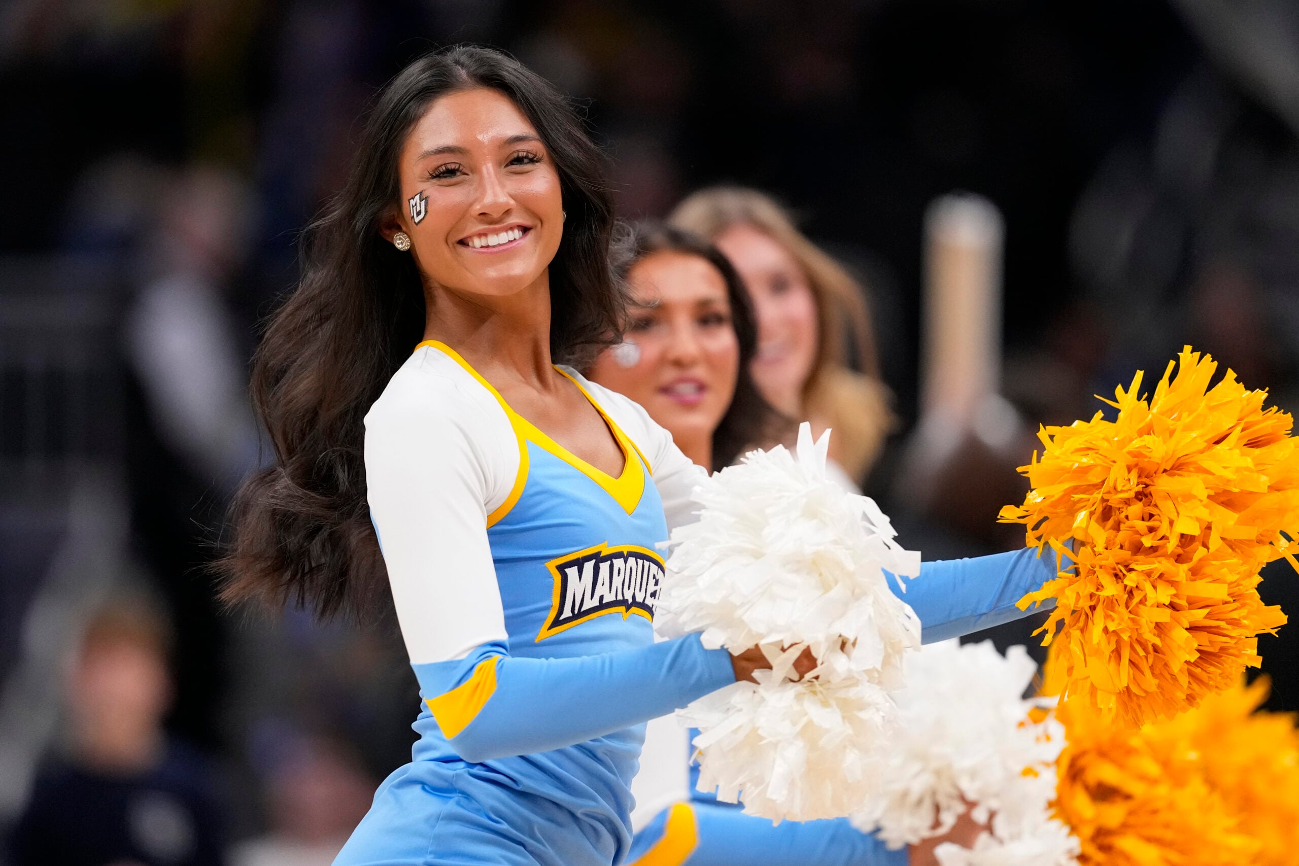 Jan 7, 2026; Milwaukee, Wisconsin, USA;  Marquette Golden Eagles cheerleaders peform during the second half against the Xavier Musketeers at Fiserv Forum. Mandatory Credit: Jeff Hanisch-Imagn Images