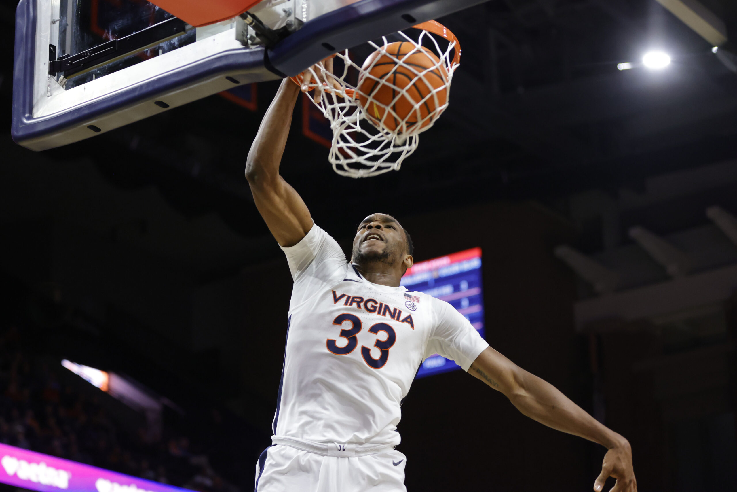 Jan 7, 2026; Charlottesville, Virginia, USA; Virginia Cavaliers center Ugonna Onyenso (33) dunks the ball against the California Golden Bears during the second half at John Paul Jones Arena. Mandatory Credit: Amber Searls-Imagn Images